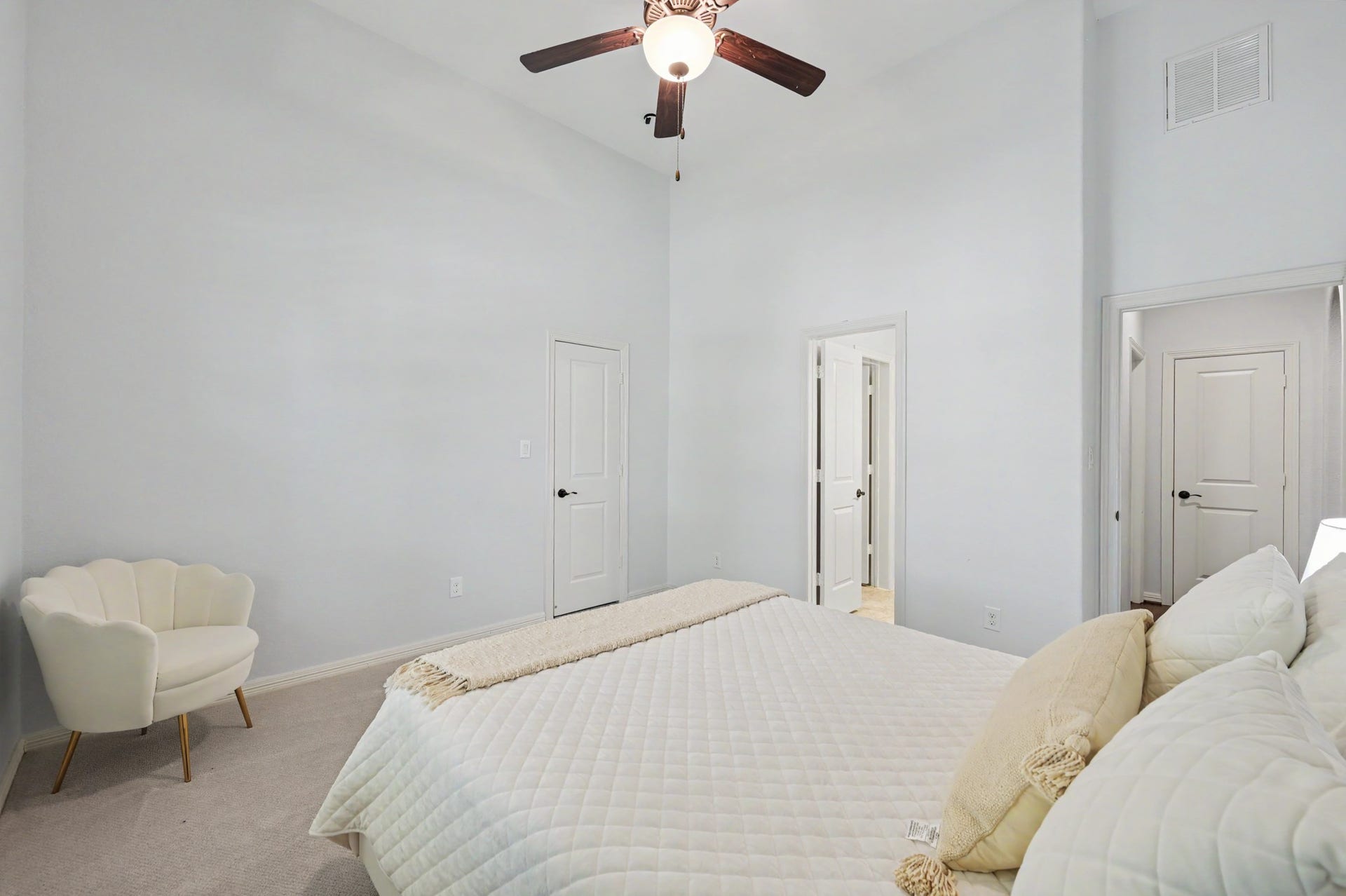 271 Rio Ranch Circle, Montgomery, TX 77316 Bright and spacious bedroom featuring a vaulted ceiling, modern ceiling fan, and soft neutral tones for a serene atmosphere.