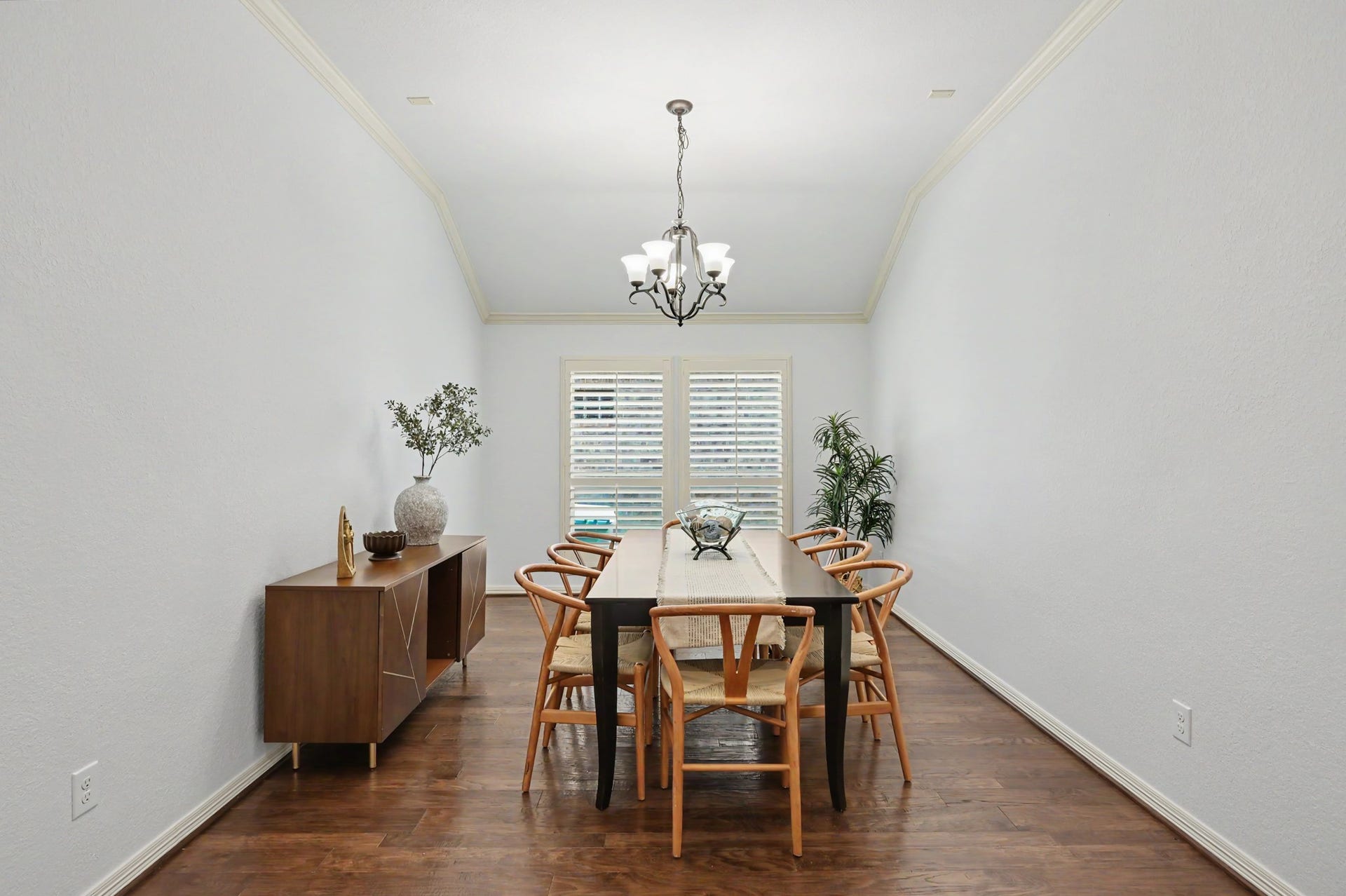 271 Rio Ranch Circle, Montgomery, TX 77316 Elegant dining room with high ceilings, hardwood floors, and ample natural light, featuring a stylish chandelier and contemporary furniture.