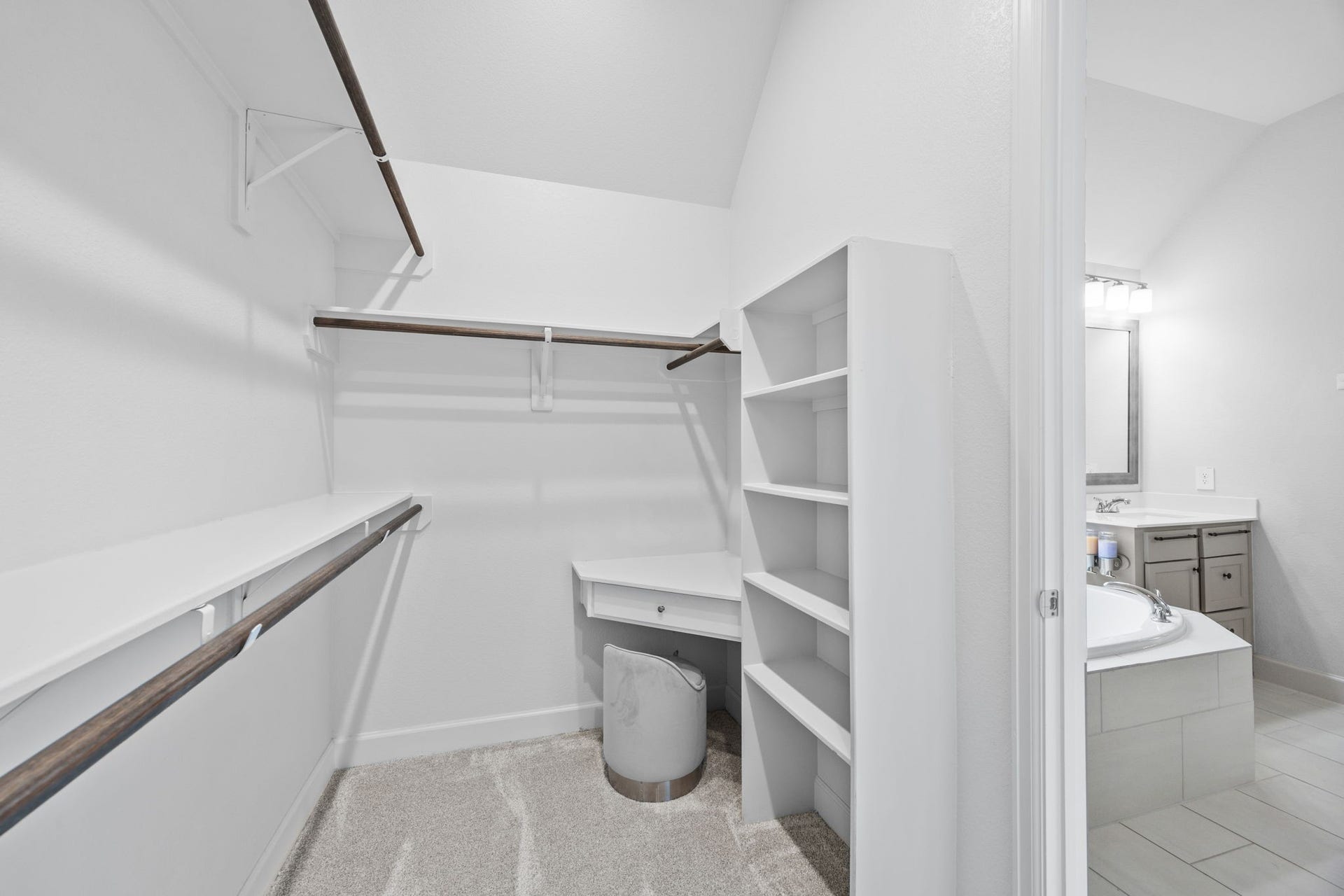 726 Fall Rock Branch Drive, Conroe, TX 77304 Expansive walk-in closet featuring built-in shelving, hanging space, and thoughtful organization.