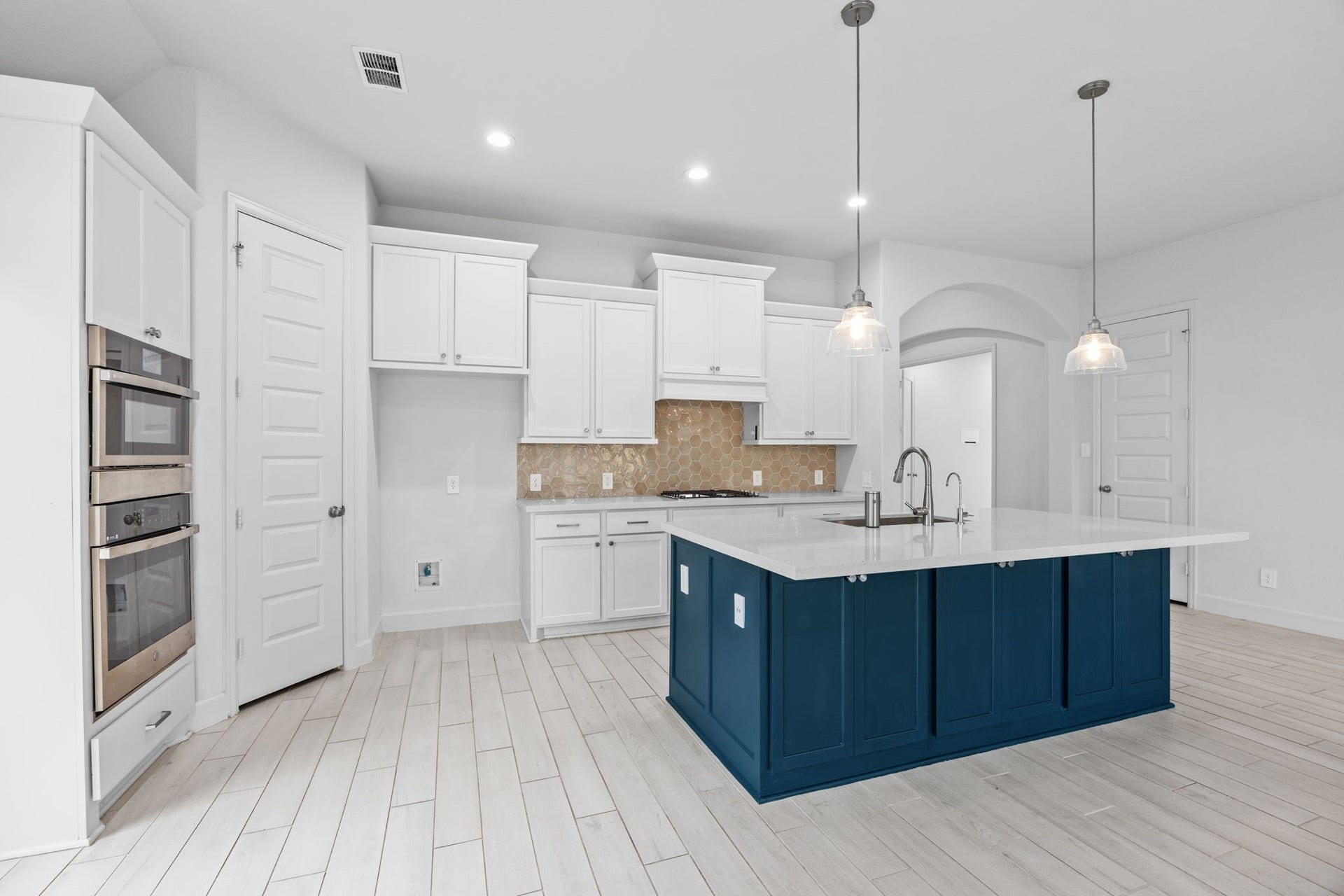 726 Fall Rock Branch Drive, Conroe, TX 77304 A spacious kitchen with a large center island that serves as the heart of the home.