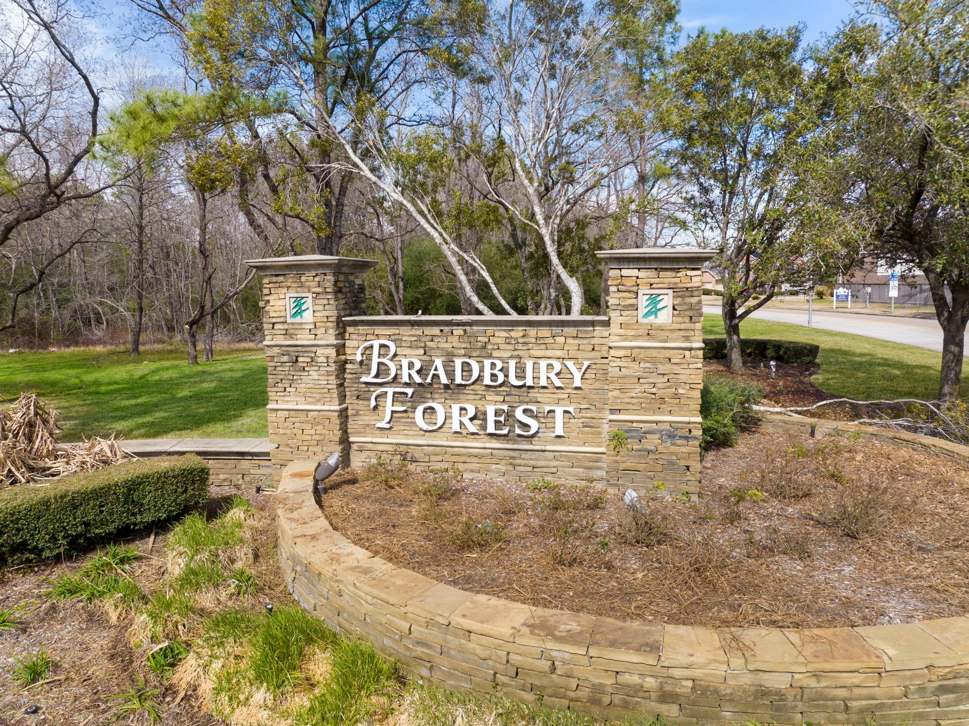 2819 Bradbury Hills Drive, Spring, TX 77373 Welcome to Bradbury Forest, where a charming stone entrance greets you with lush greenery, setting the tone for a warm and inviting community.