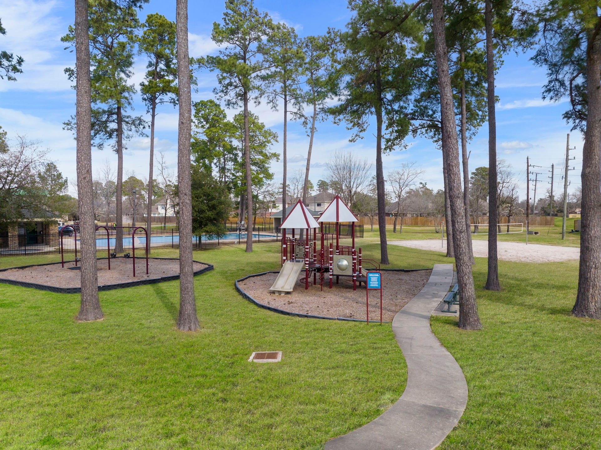 2819 Bradbury Hills Drive, Spring, TX 77373 Nestled among towering trees, this vibrant community playground offers a delightful escape for families, complete with engaging play structures and scenic surroundings.