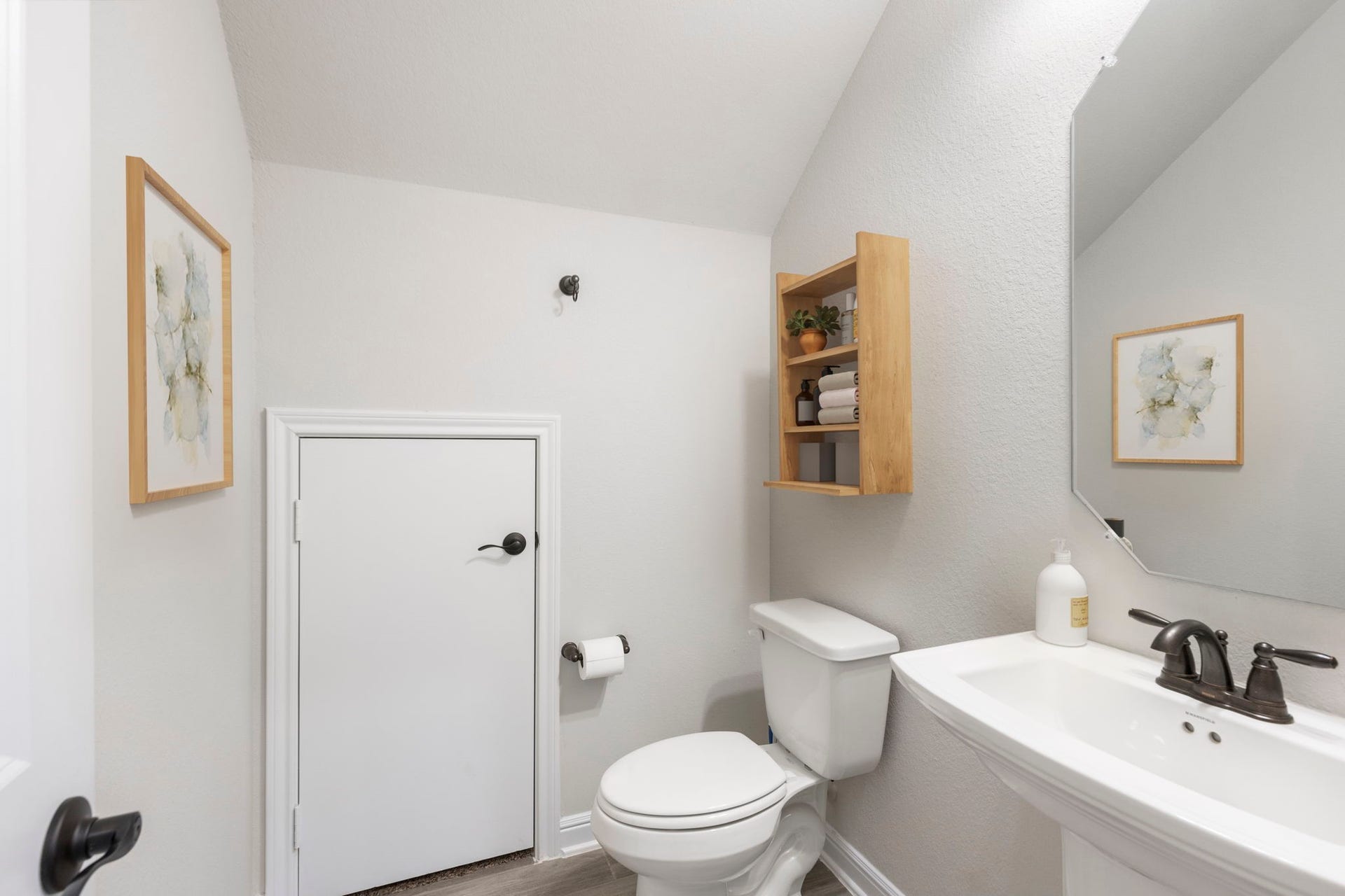 2819 Bradbury Hills Drive, Spring, TX 77373 This virtually staged bathroom offers a crisp, modern feel with its sleek white fixtures, minimalist decor, and efficient use of space, perfect for stylish living.
