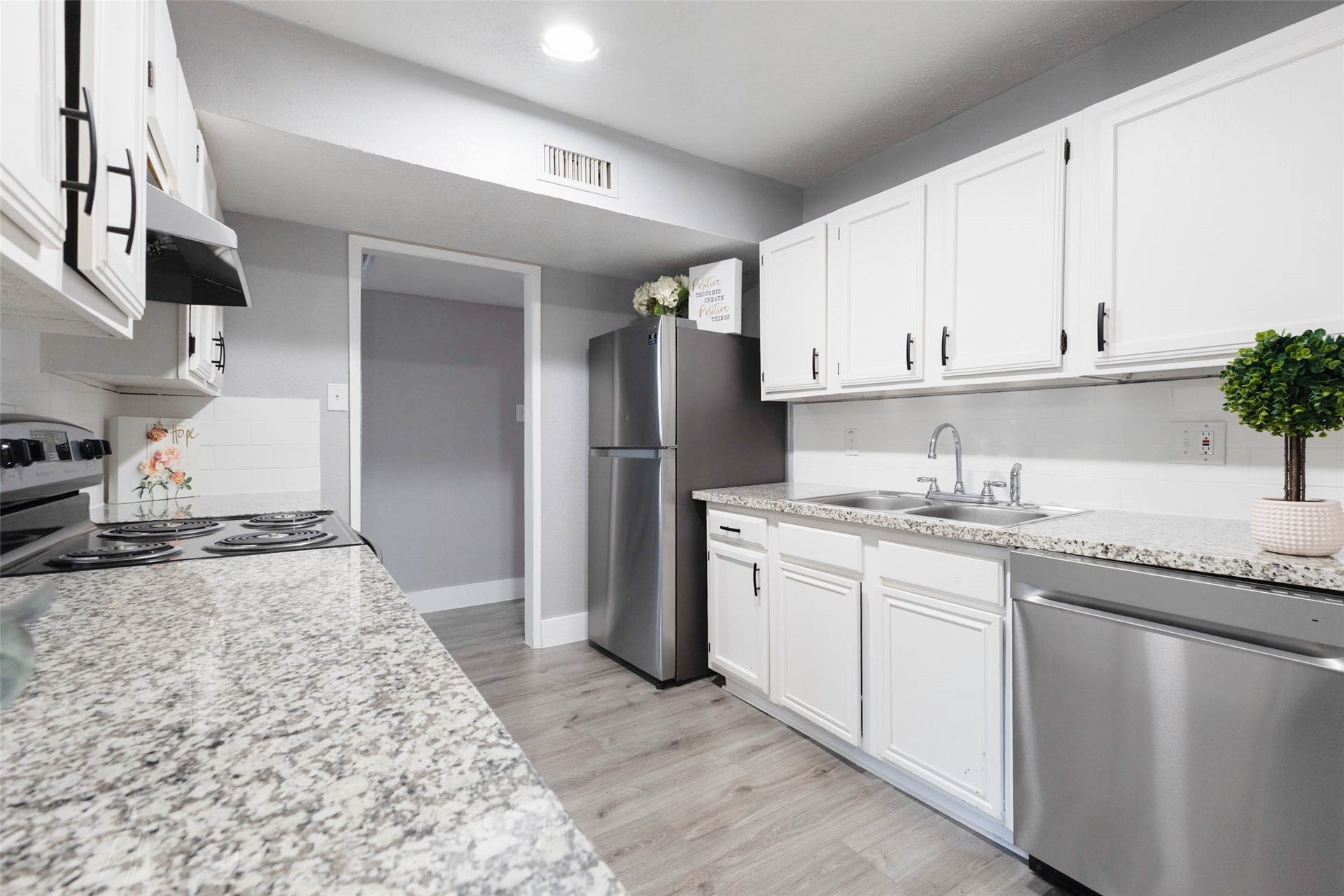 17302 S Yorkglen Drive, Houston, TX 77084 Deep stainless sink and new dishwasher, with easy flow to the laundry closet and hallway.