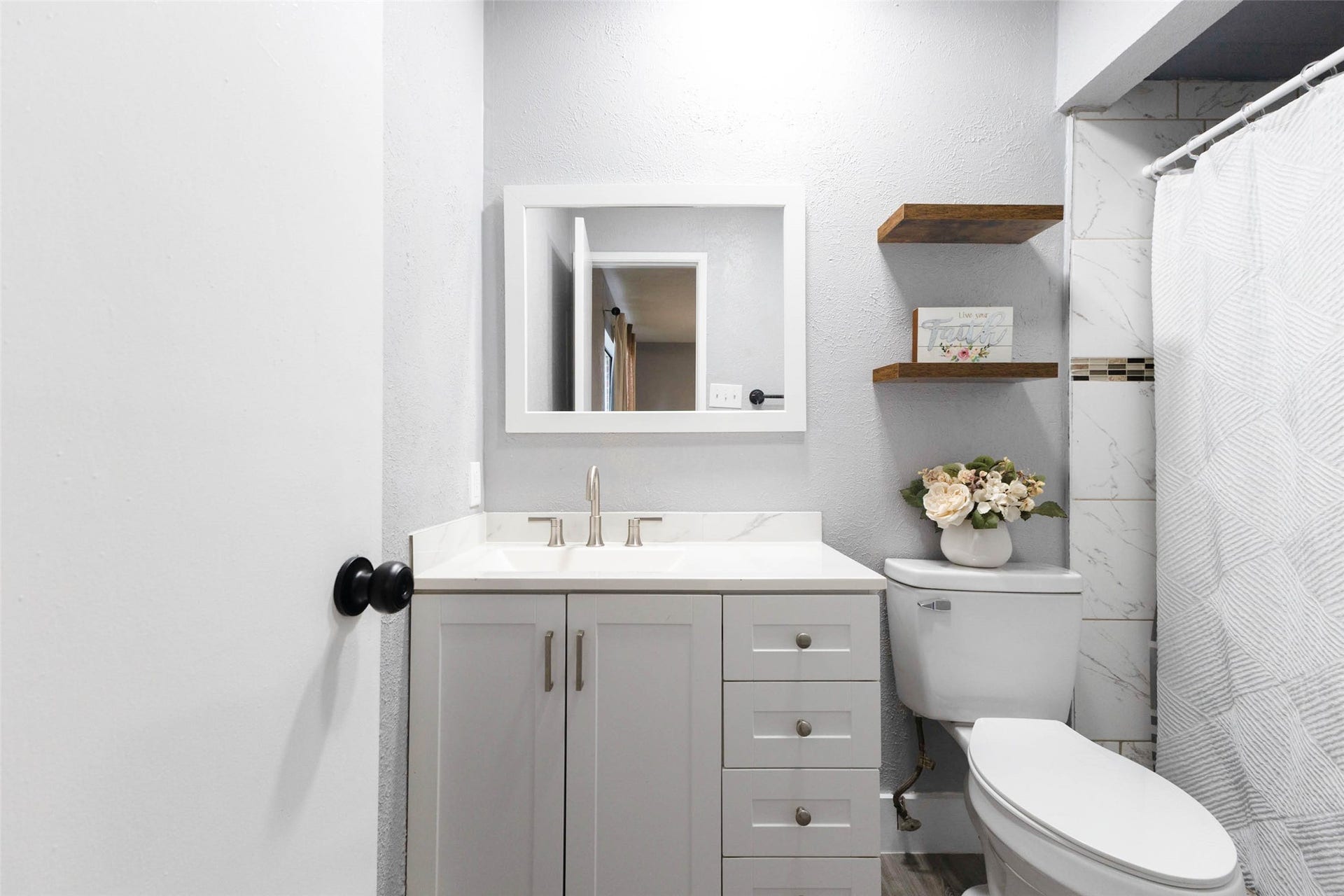 17302 S Yorkglen Drive, Houston, TX 77084 Full bathroom with a tub-shower combo and a clean, updated vanity.