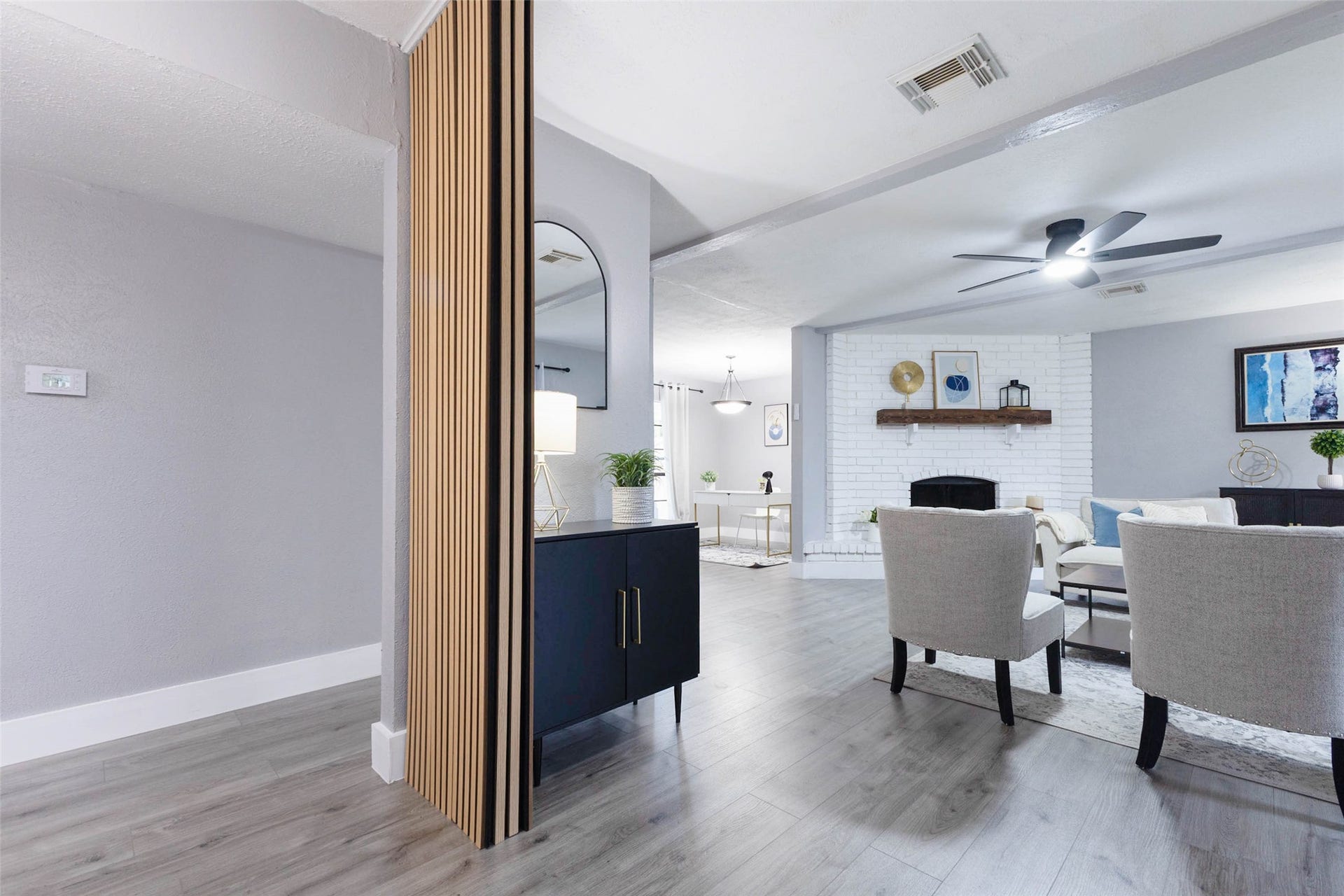 17302 S Yorkglen Drive, Houston, TX 77084 A designer wood-slat accent wall greets you at the entry, flowing right into the main living space.
