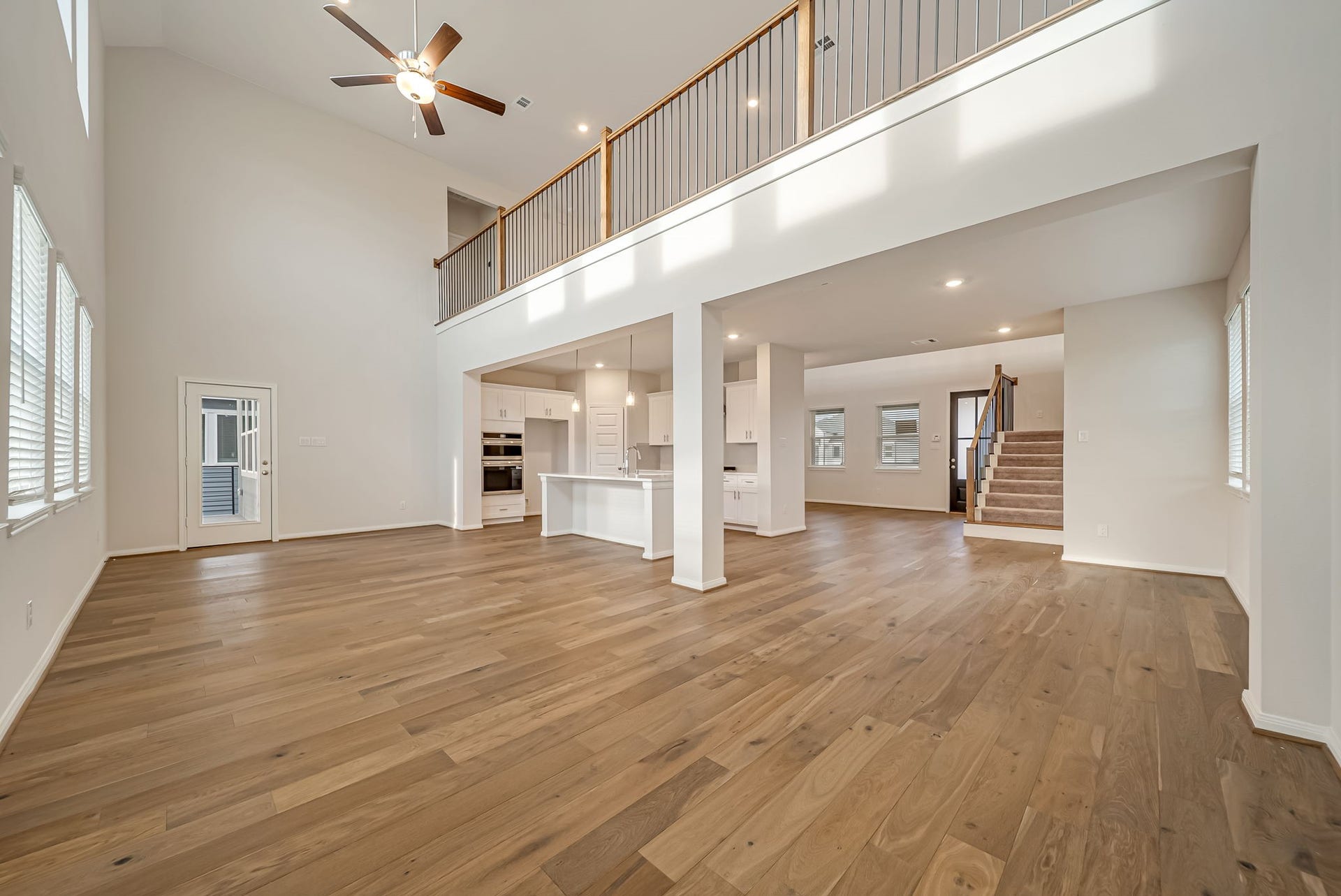 20633 Dynamic Court, Humble, TX 77338 Light and bright family room open to the kitchen and breakfast room with door to the back balcony.