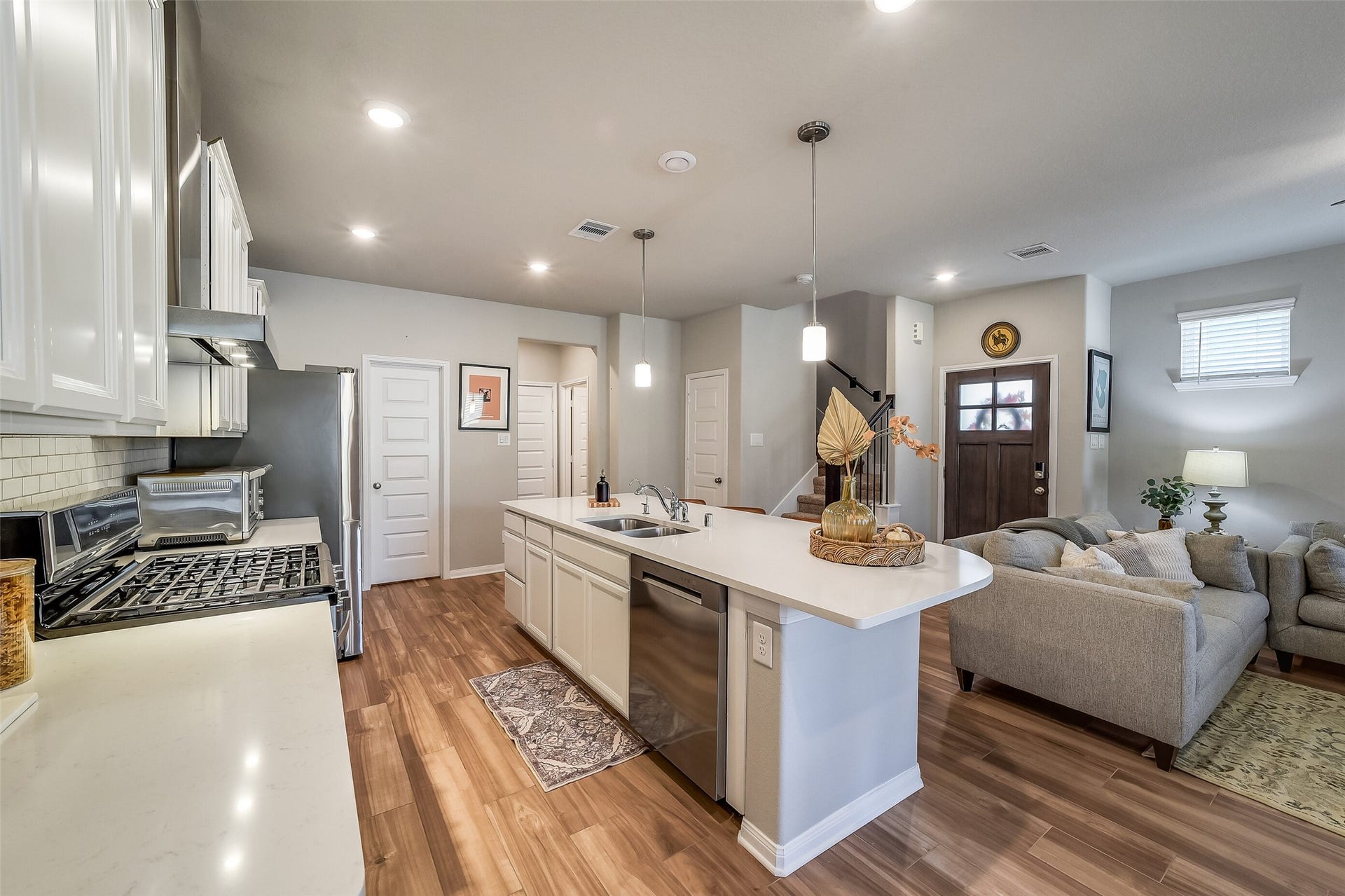 Prepare meals while staying part of the conversation, with the island overlooking the living room and offering convenient seating for guests.