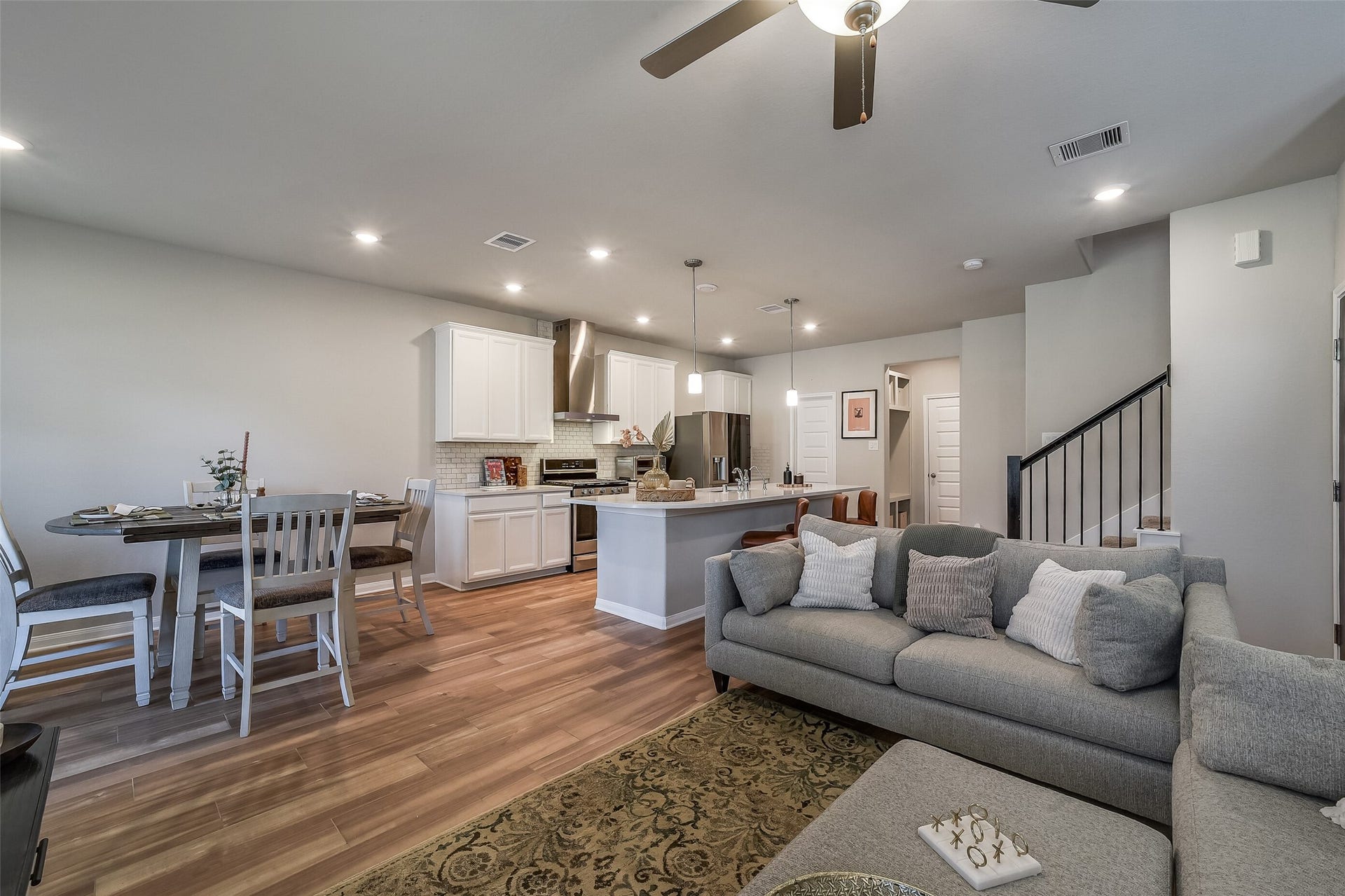 An open layout lets you stay connected while cooking, dining, or relaxing, with continuous wood-look flooring tying the spaces together.
