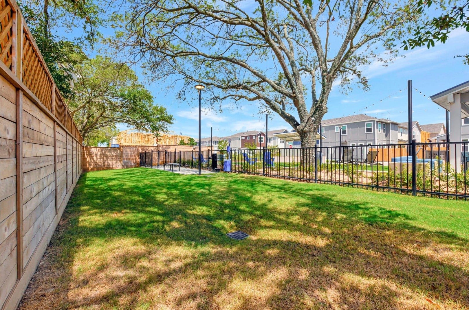 Give your four-legged companion room to play in the fenced community dog park, with a grassy lawn and shade from mature trees.