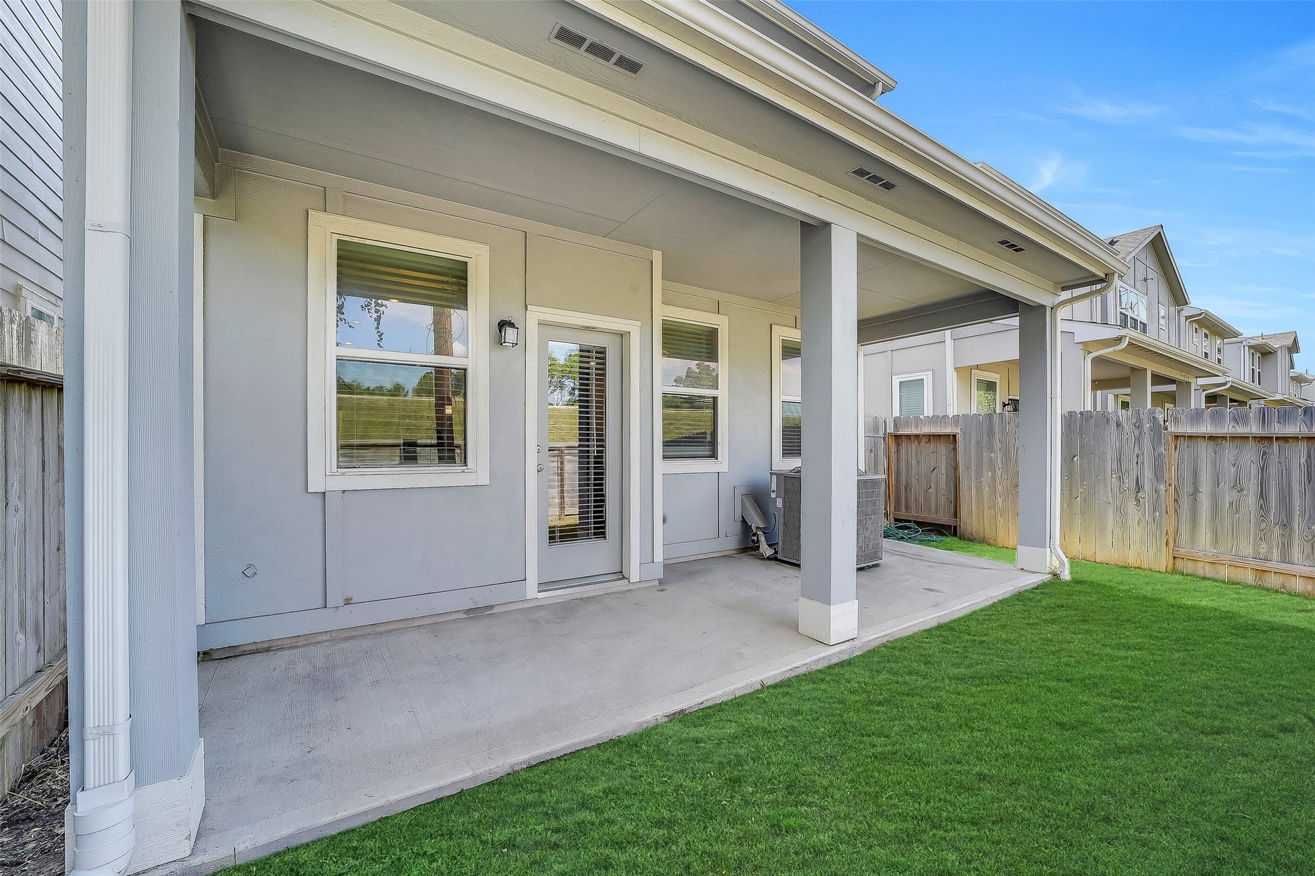Just outside the breakfast area, this covered patio offers a welcoming spot for morning coffee or a quiet evening outdoors.