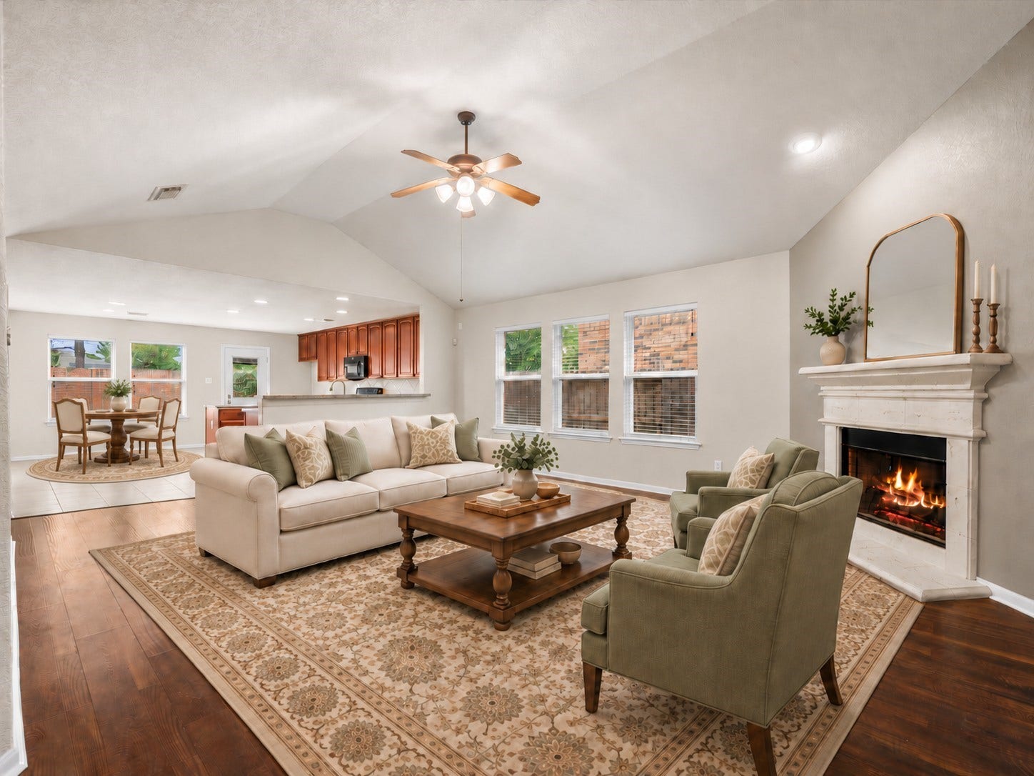 20118 Monarda Manor Court, Spring, TX 77379 Furnishings have been virtually added to showcase the possibilities of this open-concept living area, where soaring ceilings, abundant natural light, and a cozy fireplace create a welcoming gathering space.