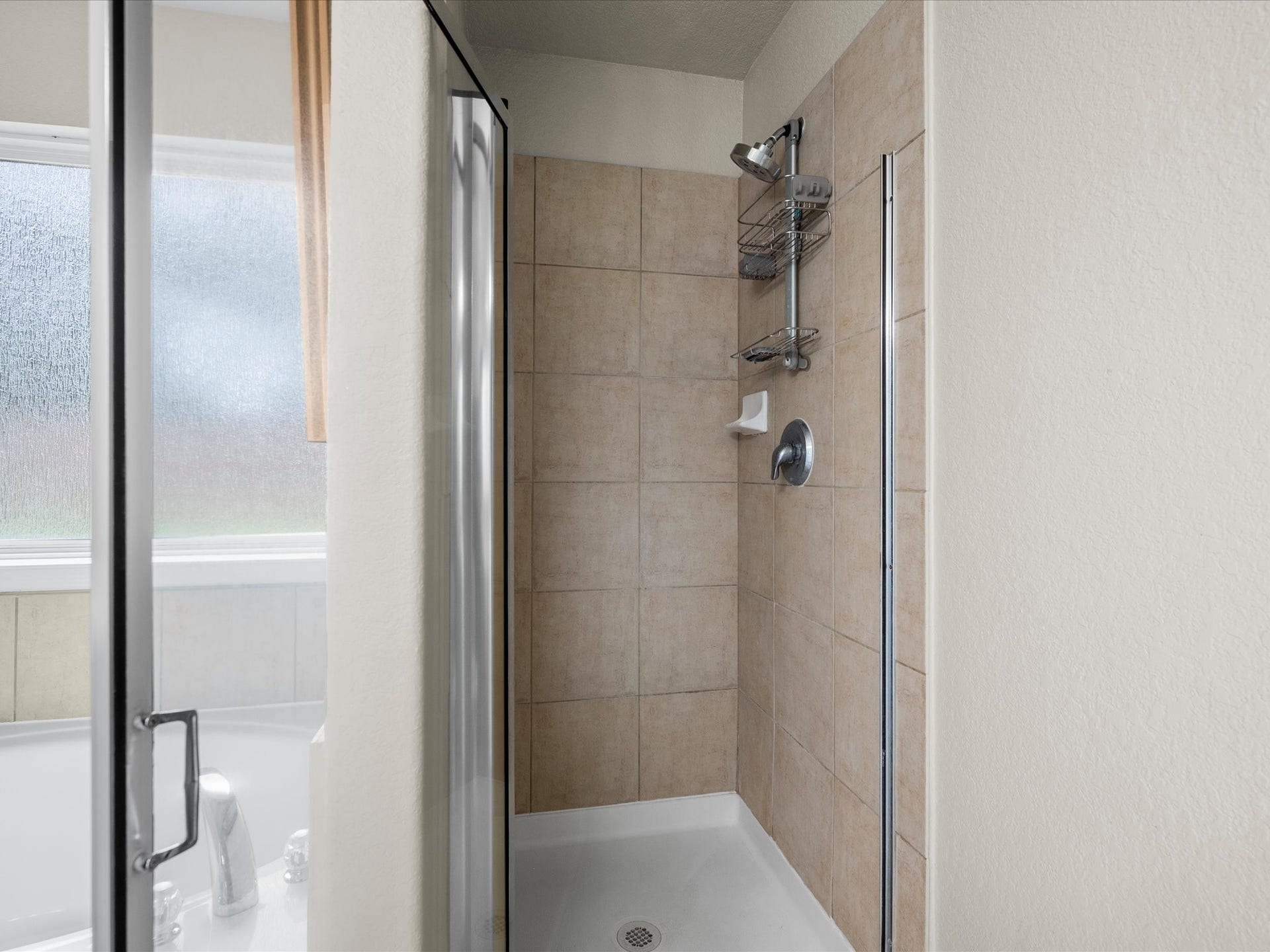 20118 Monarda Manor Court, Spring, TX 77379 The primary bathroom offers added convenience with a separate shower, providing a functional and comfortable space to start and end each day.