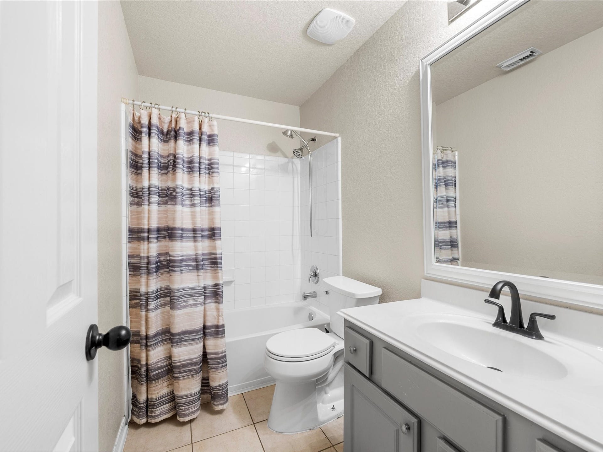 20118 Monarda Manor Court, Spring, TX 77379 The full secondary bathroom offers functionality and convenience with a well-designed layout for family members or guests.