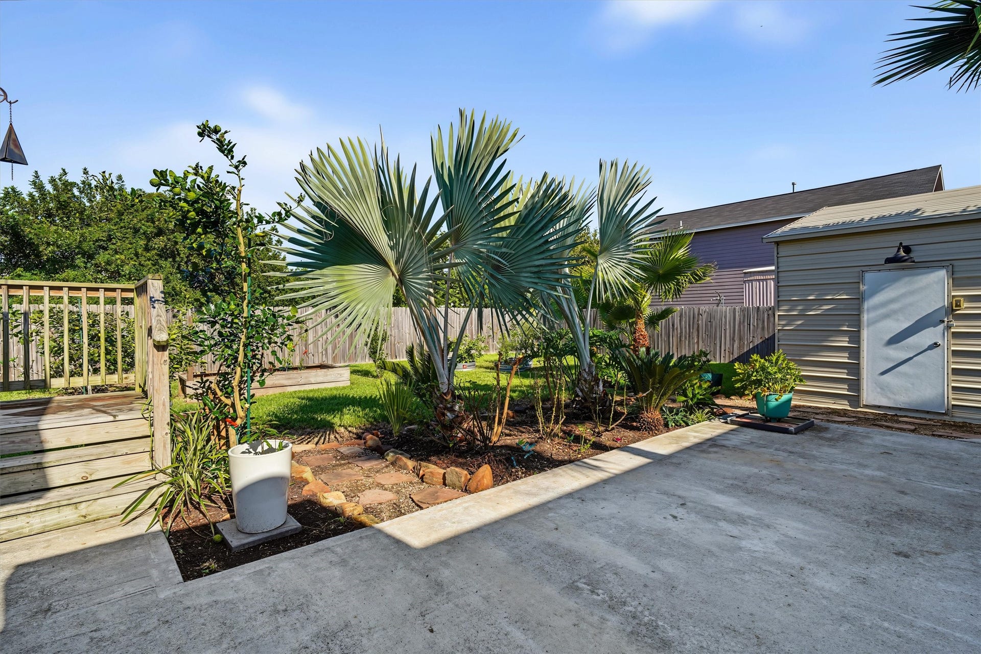 546 5th Street, Dickinson, TX 77539 View of concrete patio and landscaping. This backyard just spell RELAX