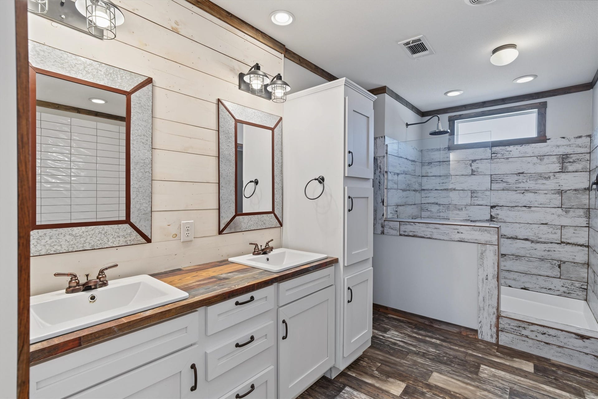 546 5th Street, Dickinson, TX 77539 Spa-Like Primary Ensuite A beautifully appointed primary bathroom featuring dual sinks and an oversized walk-in shower, creating a spacious and relaxing retreat with plenty of storage