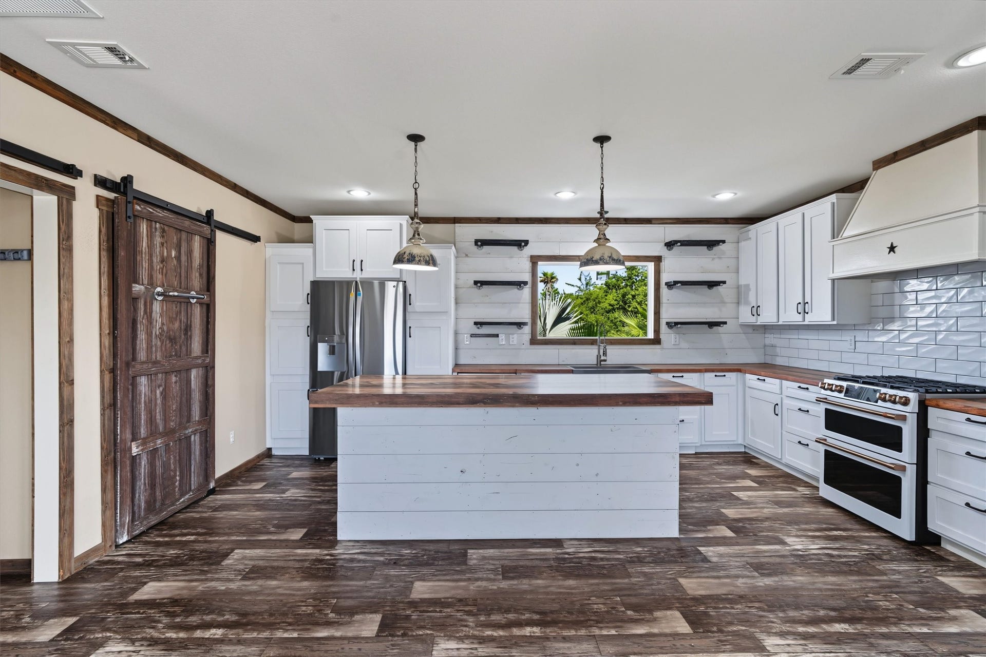 546 5th Street, Dickinson, TX 77539 Gorgeous White Kitchen Beautiful white cabinetry paired with stunning countertops and a stylish backsplash create a bright, fresh, and inviting kitchen thats perfect for both everyday living and entertaining