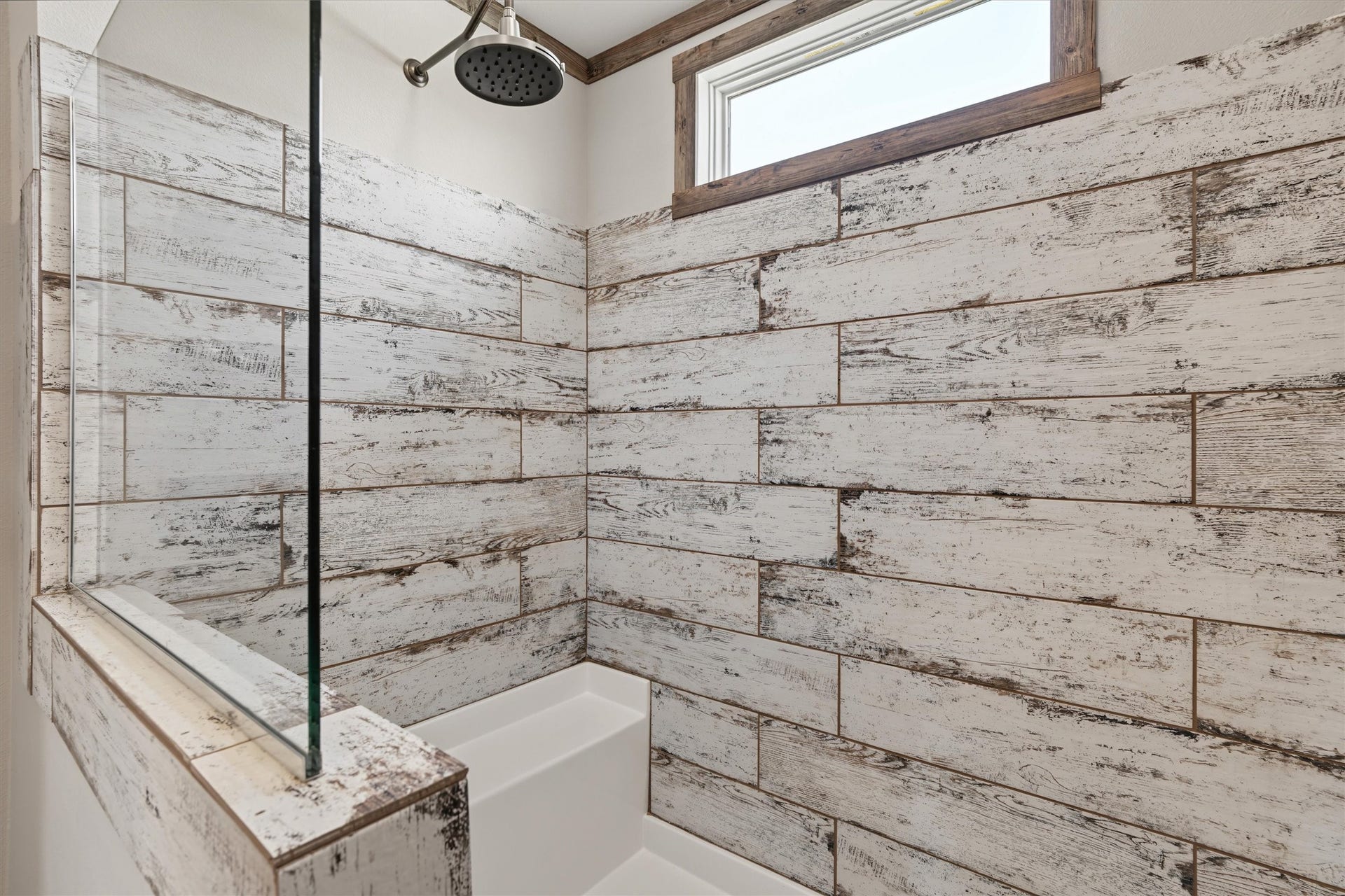 546 5th Street, Dickinson, TX 77539 Beautifully Tiled Walk-In Shower An oversized walk-in shower with stylish tilework offers a spacious, modern, and inviting space to start and end your day