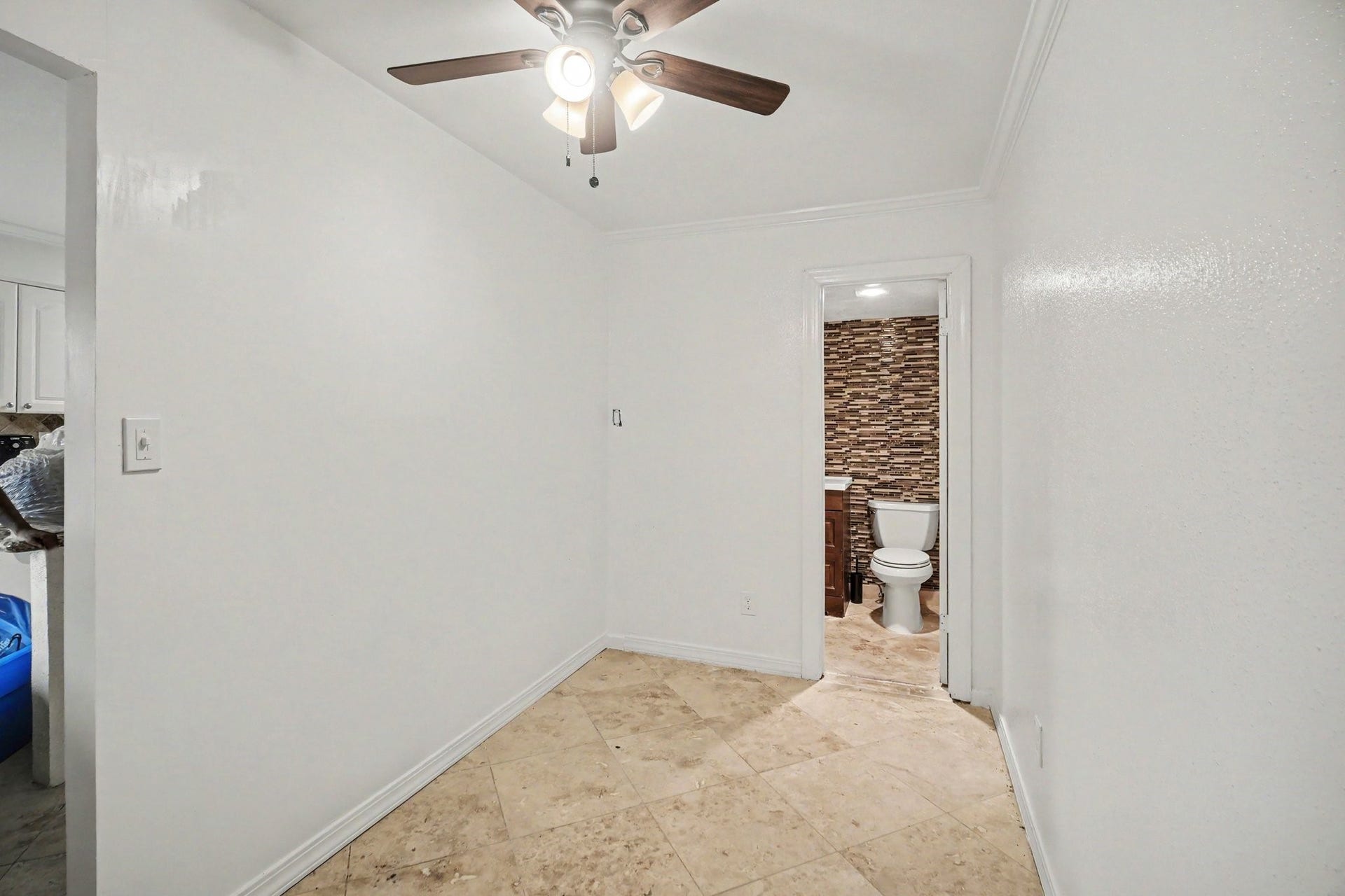Discover versatile living with this flexible space, perfect for an office or creative studio, complete with a convenient half bath for added comfort.