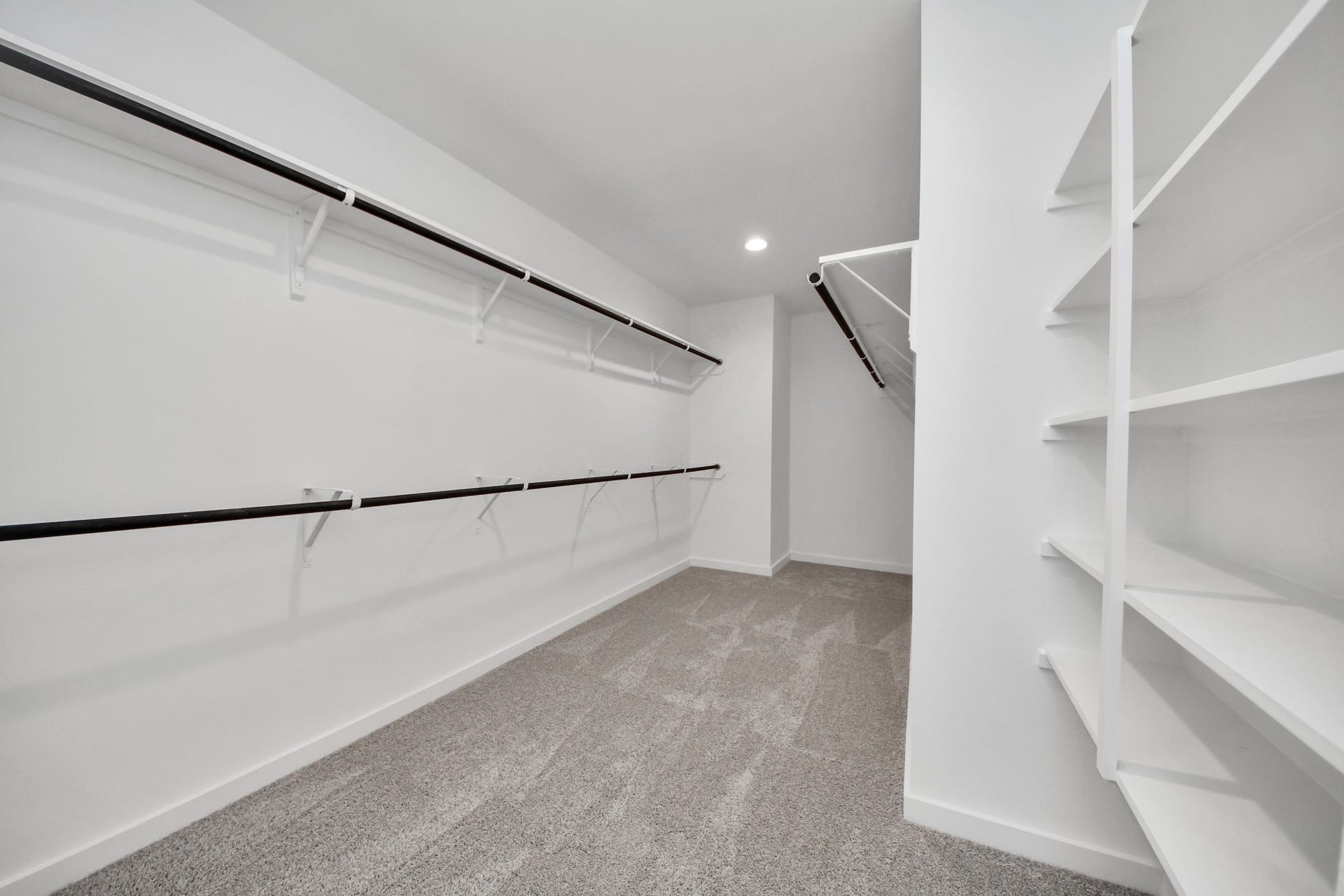 5818 Madison Trail Drive, Richmond, TX 77469 Secondary bedroom features plush carpeting, large windows that let in plenty of natural light, bright paint, and spacious closets. Sample photo of completed home with similar floor plan. Actual colors and selections may vary.