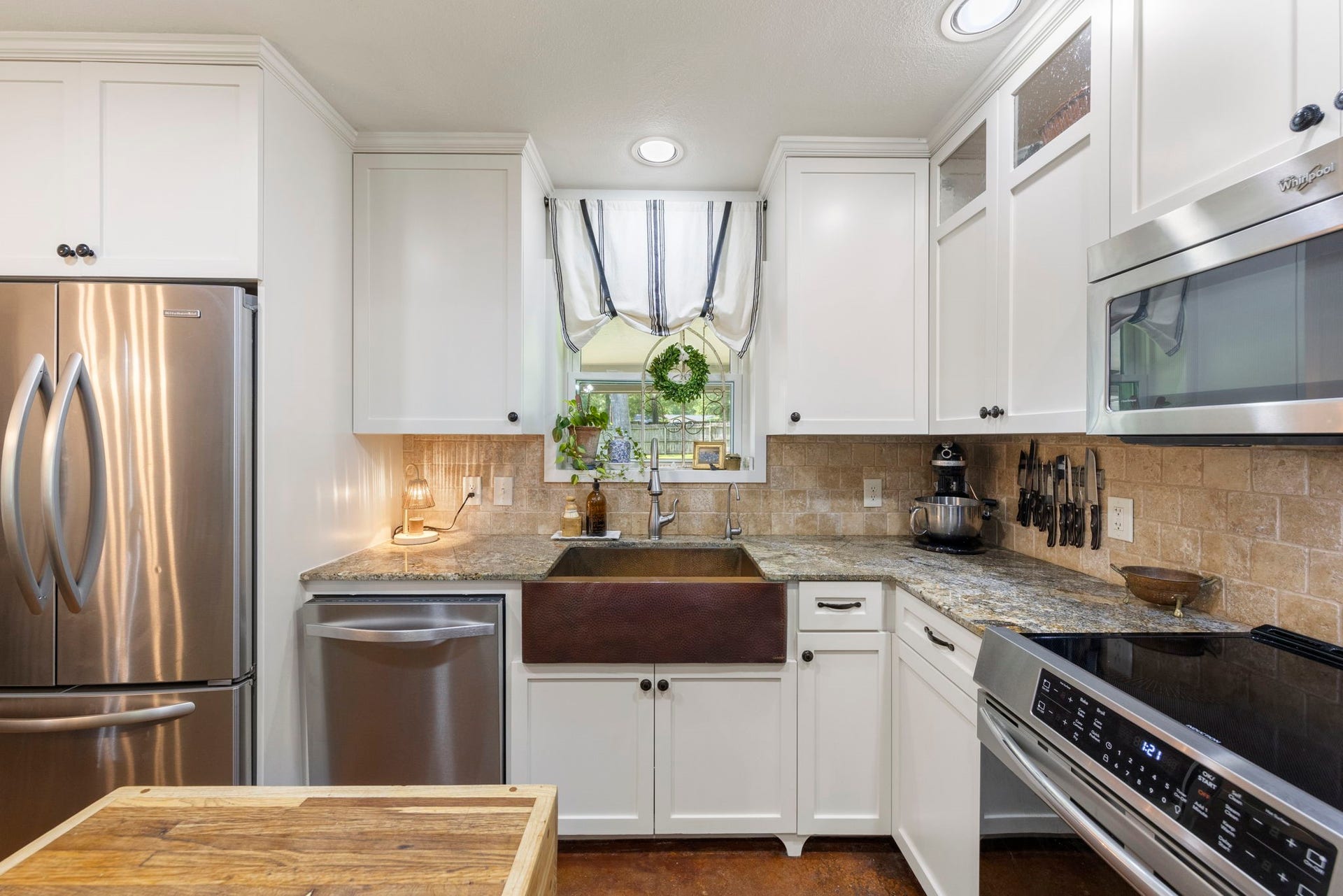 Take in serene backyard views from the kitchen, creating a bright and inviting atmosphere.