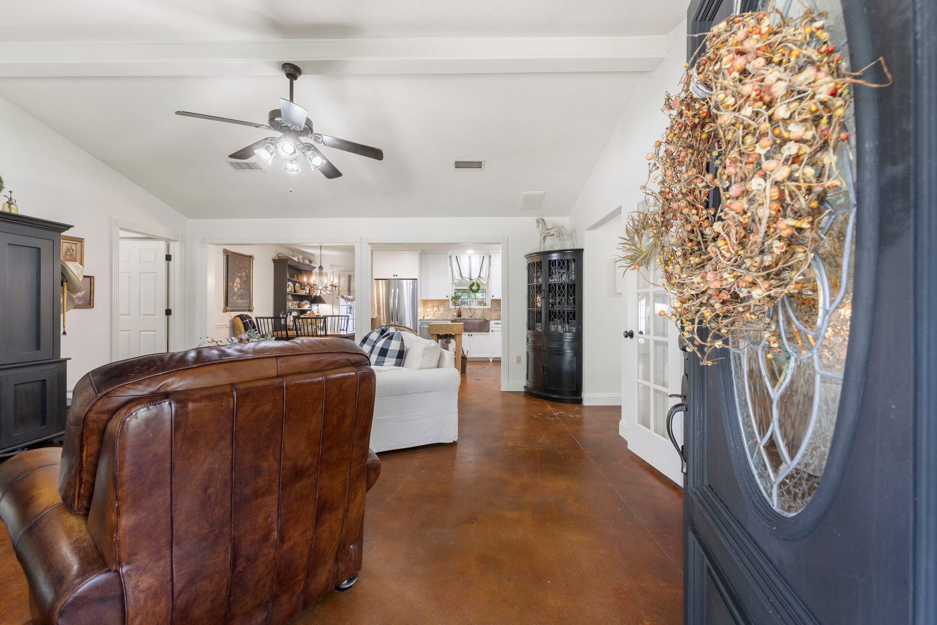 Step inside to a warm and inviting interior where an open layout, abundant natural light, and seamless sightlines create an ideal setting for both everyday living and effortless entertaining.