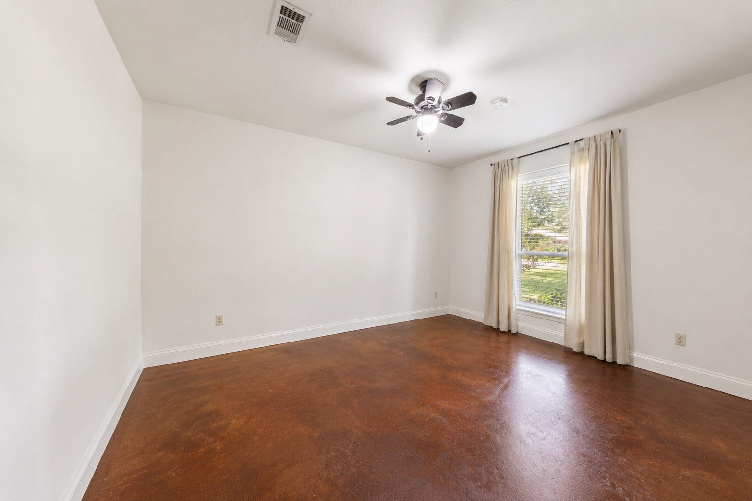 Versatile third bedroom, offering endless possibilities as a guest room, office, or flex space.