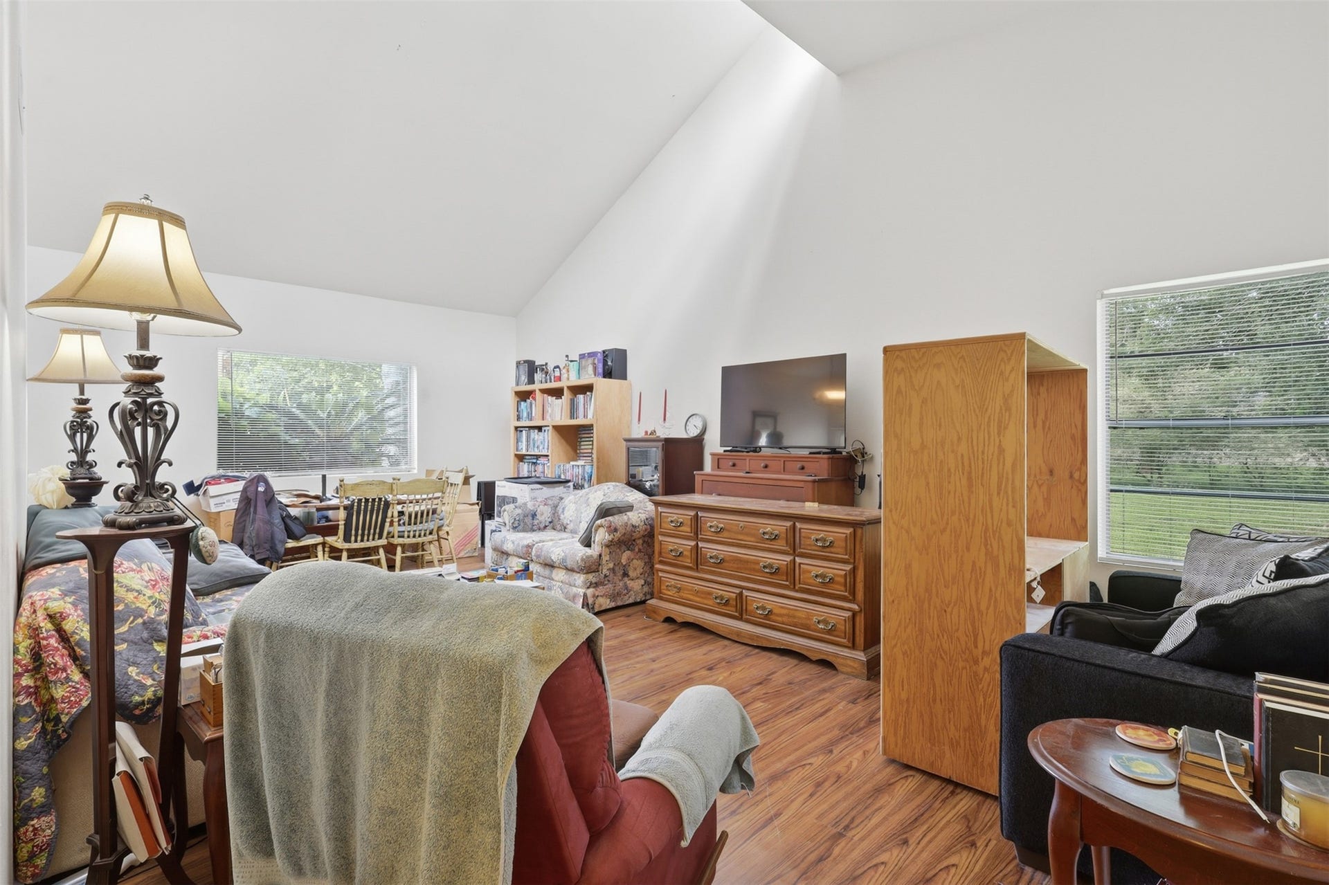 Angled vaulted ceilings catch natural light from every side, creating a cozy yet spacious atmosphere meant for gathering.