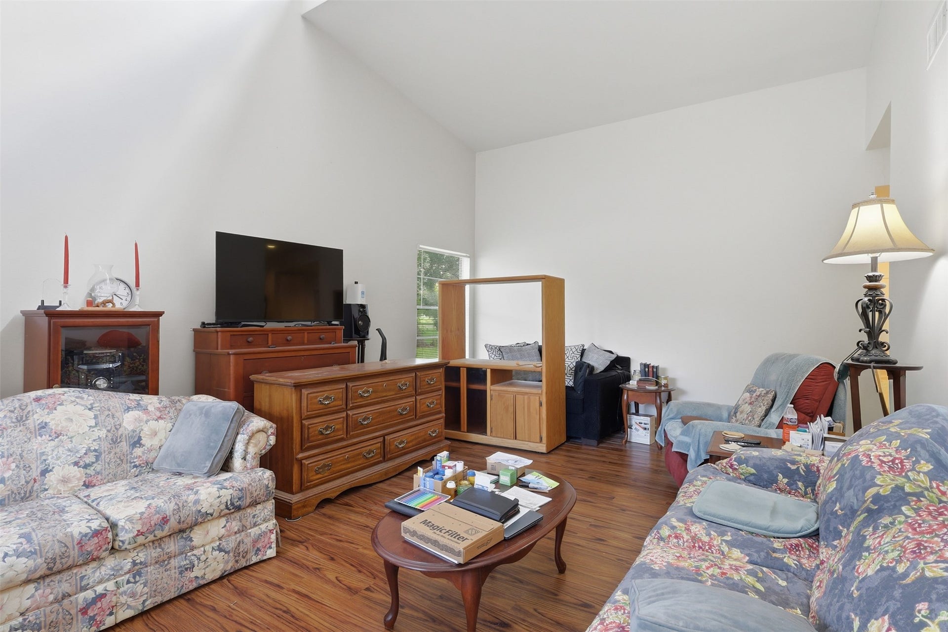 Dramatic skylight accents highlight the expansive main living room, offering endless potential for custom furniture arrangements.
