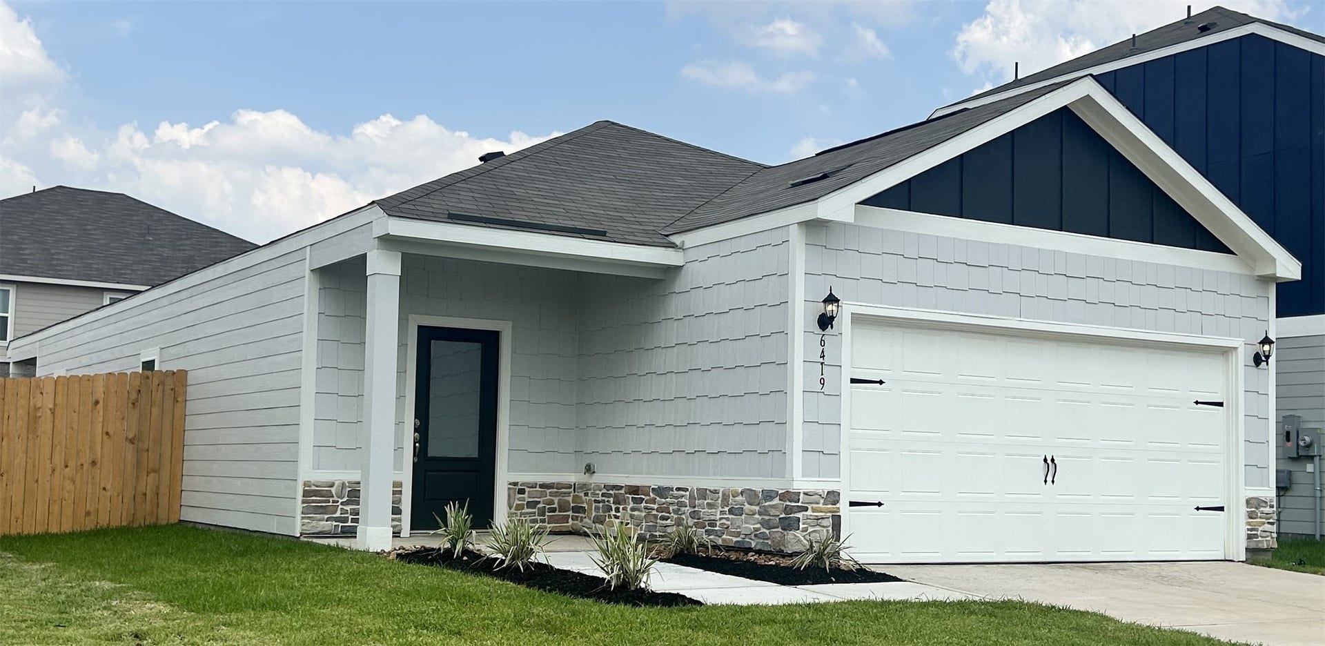6419 Winter Elm Street, Houston, TX 77048 The Dogwood floor plan has beautiful stone detailing on the faade of the home.