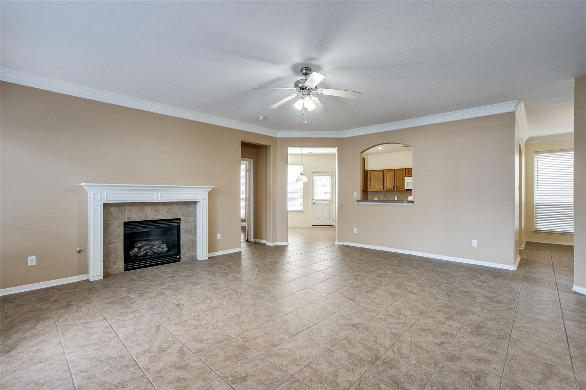 9907 Valance Way, Conroe, TX 77385 View from back door to living room and kitchen with gas log fireplace!