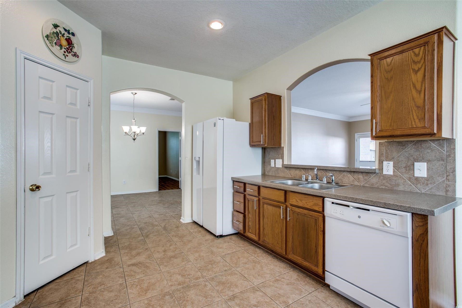9907 Valance Way, Conroe, TX 77385 View from breakfast nook to kitchen and pantry