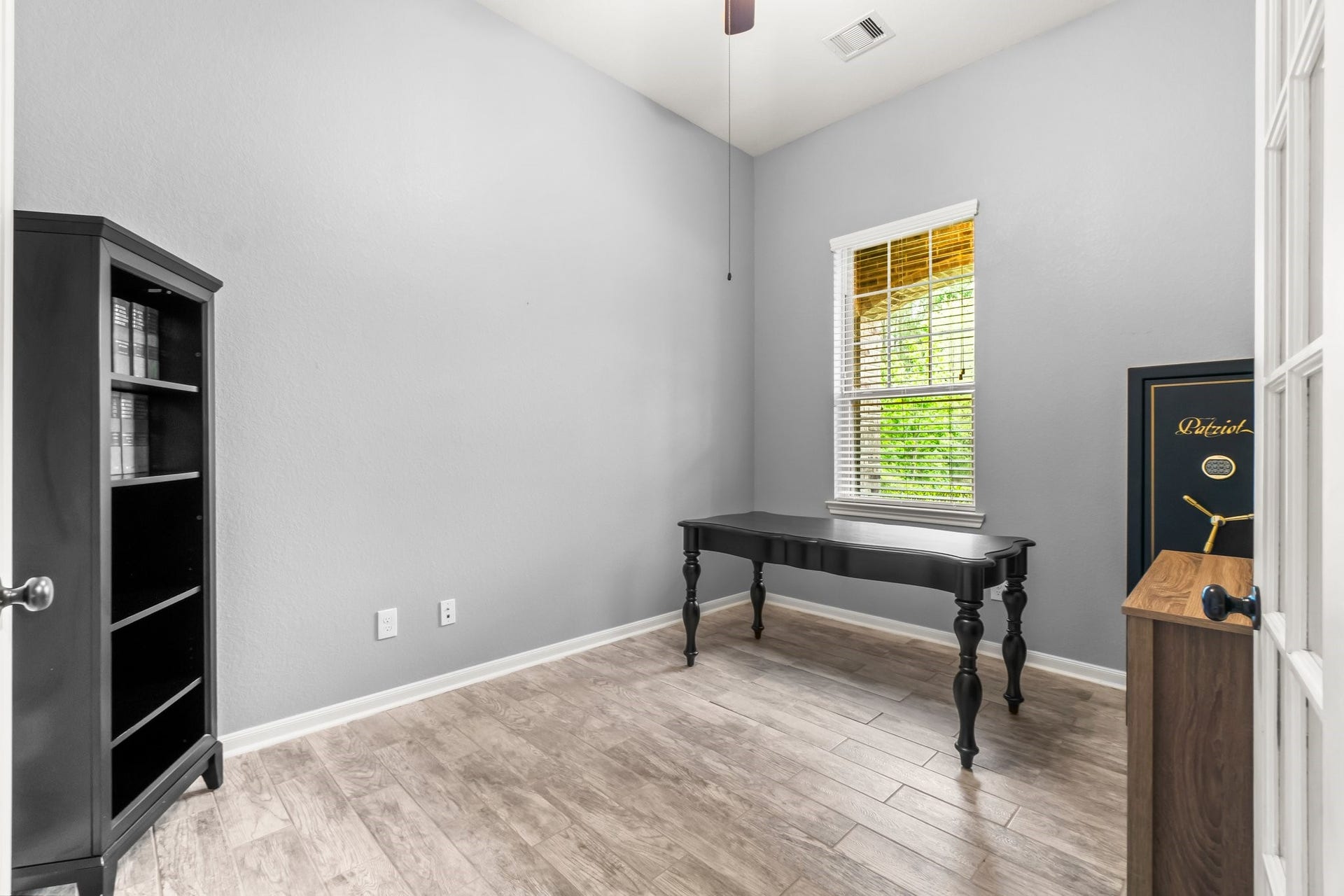 Office/Study featuring elegant tall French doors for a sophisticated touch.