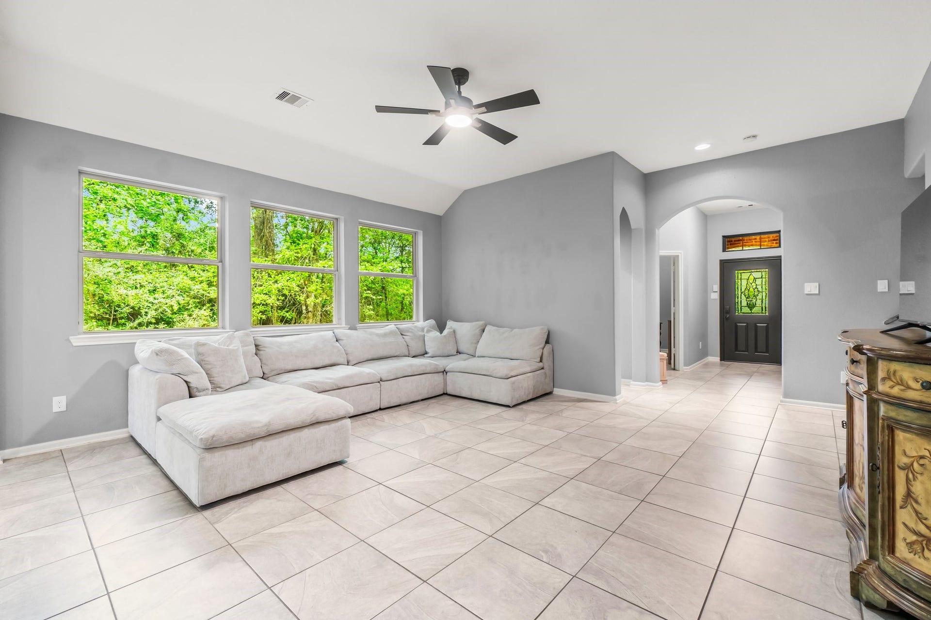 The living room seamlessly opens to the kitchen, creating the perfect space for entertaining.