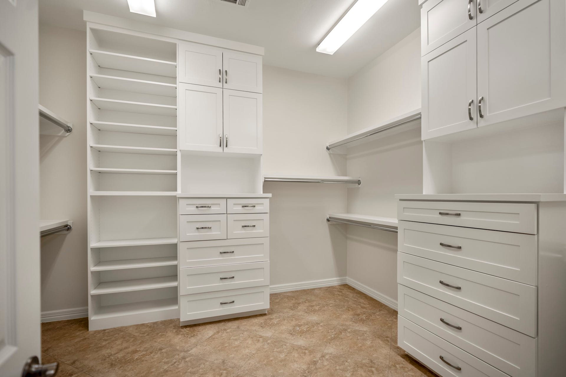 863 Plainwood Drive, Houston, TX 77079 The primary bathroom connects directly to a spacious custom closet with extensive built-in storage.