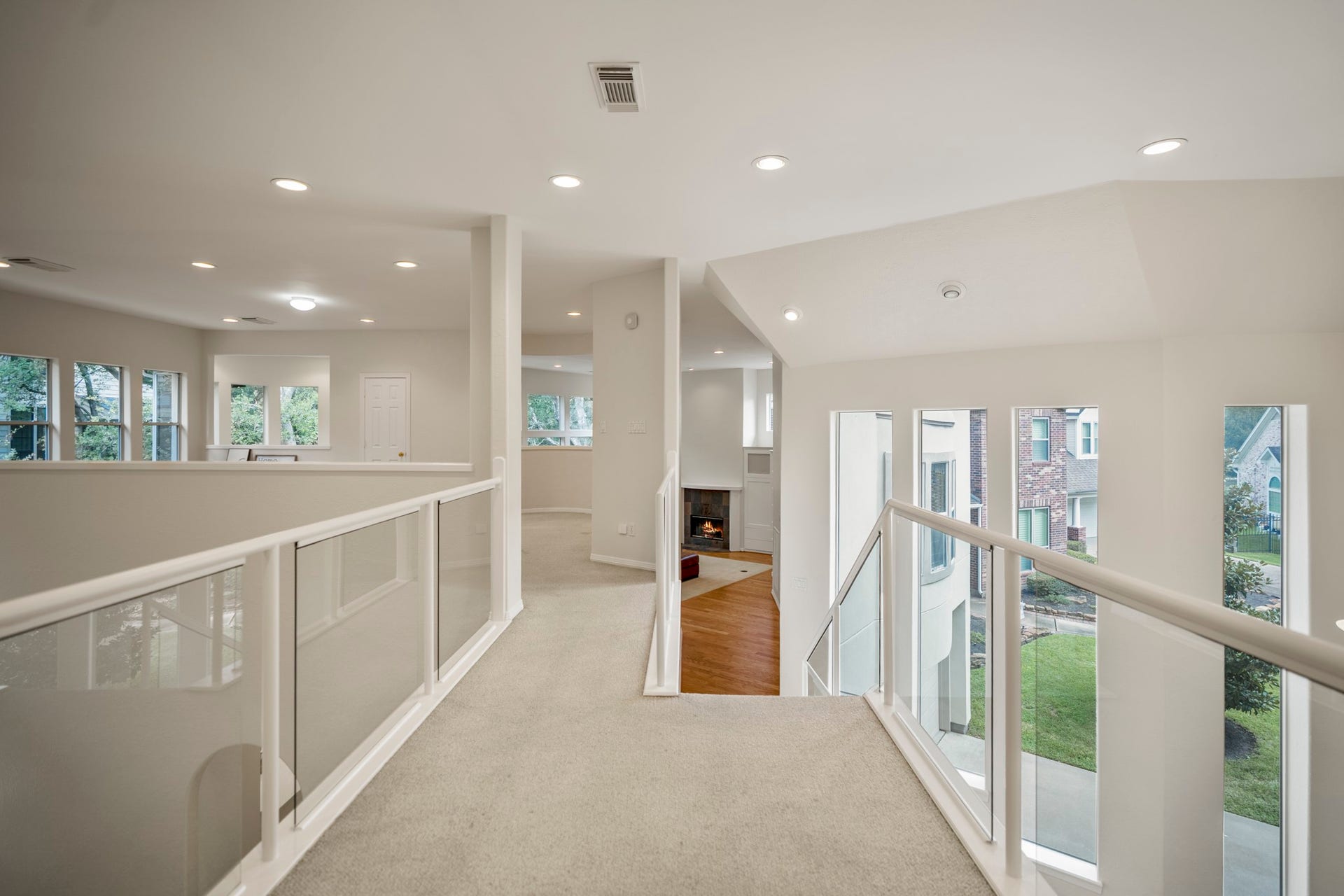 863 Plainwood Drive, Houston, TX 77079 Hallway off of the third floor living room and stairway leading to the secondary bedrooms