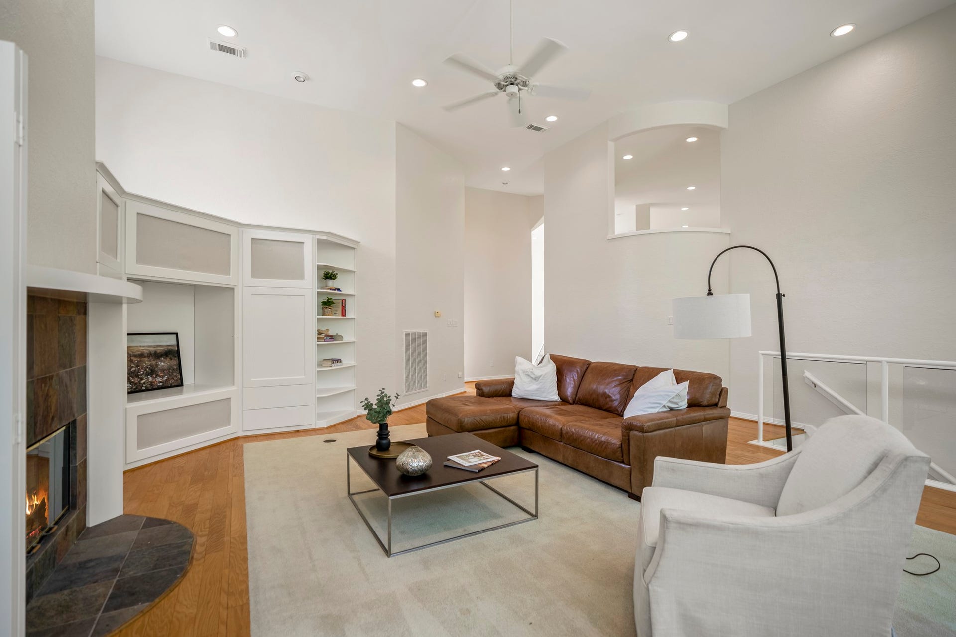 863 Plainwood Drive, Houston, TX 77079 Soaring ceilings and floor-to-ceiling windows fill the main living room with natural light.