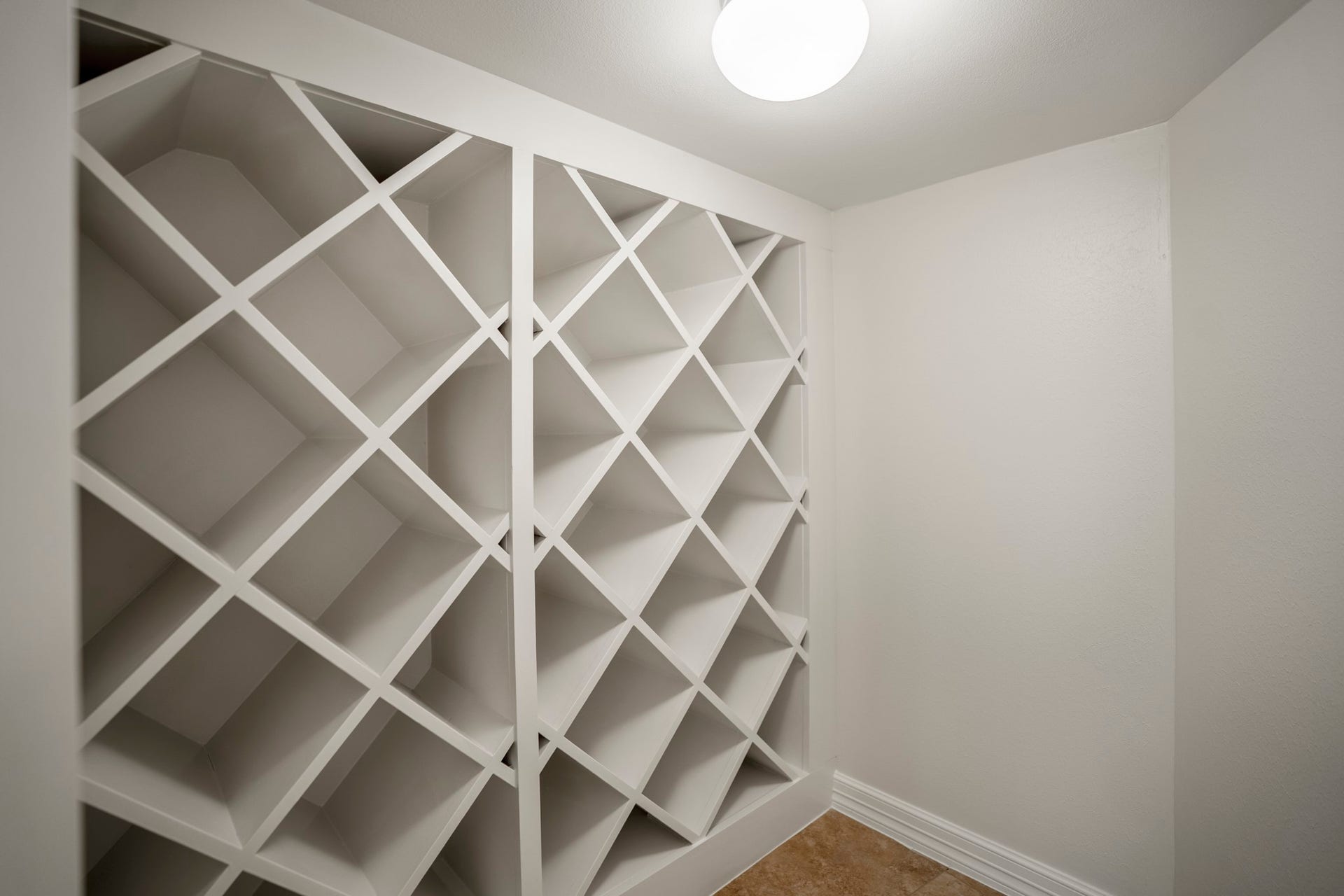 863 Plainwood Drive, Houston, TX 77079 Thoughtful storage continues with multiple pantries, built-ins and a dedicated wine closet.