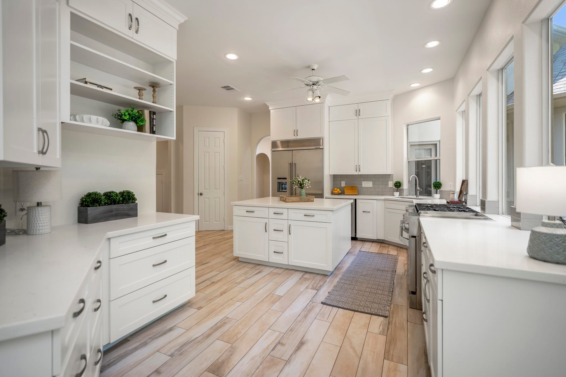 863 Plainwood Drive, Houston, TX 77079 A large gas range, double ovens and built-in refrigerator equip the kitchen for serious cooking.