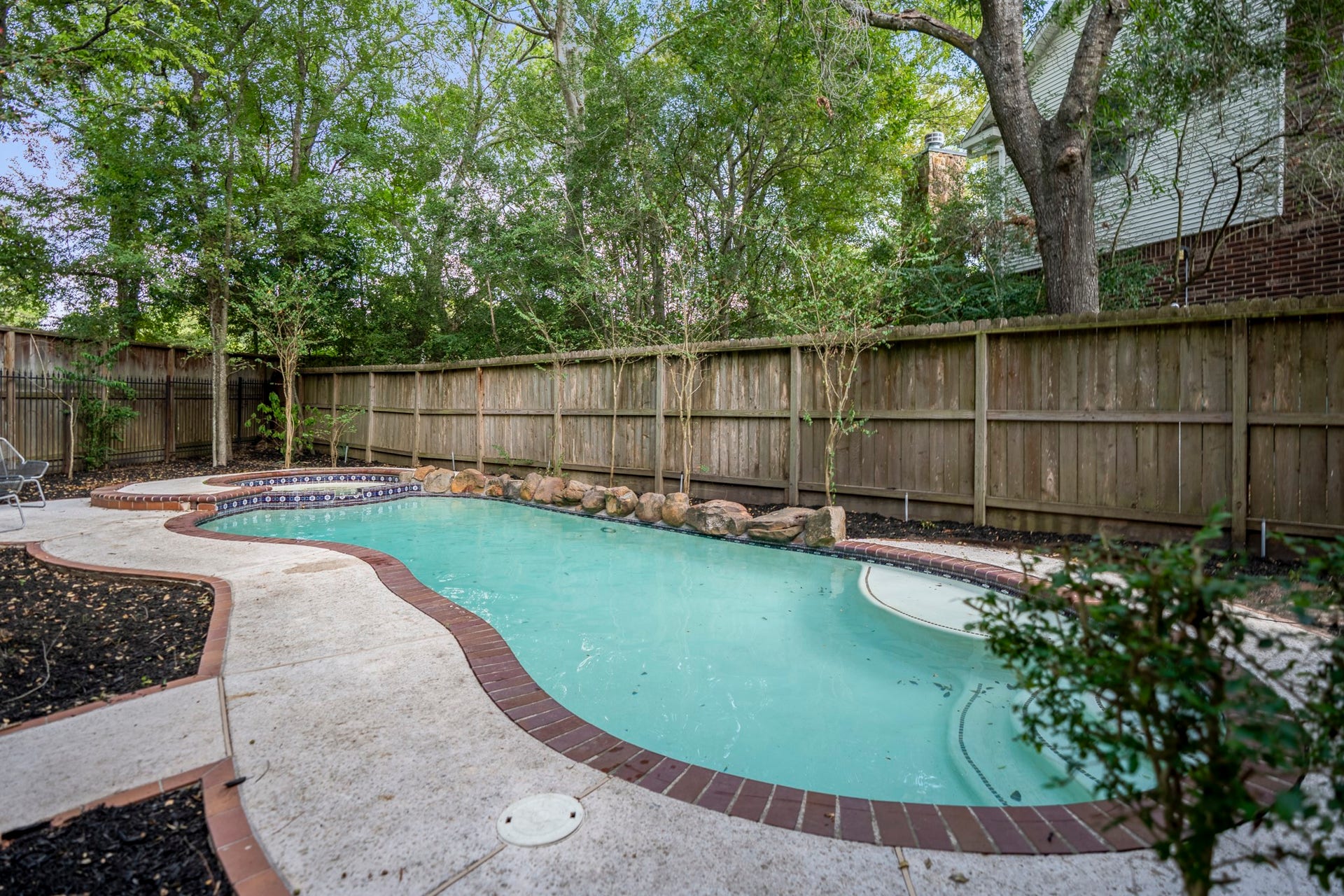 863 Plainwood Drive, Houston, TX 77079 View of the pool and spa