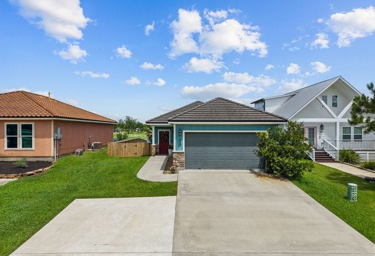 639 29th Street, San Leon, TX 77539 Front elevation! Tile roof, with stone accents make this home really stand out!