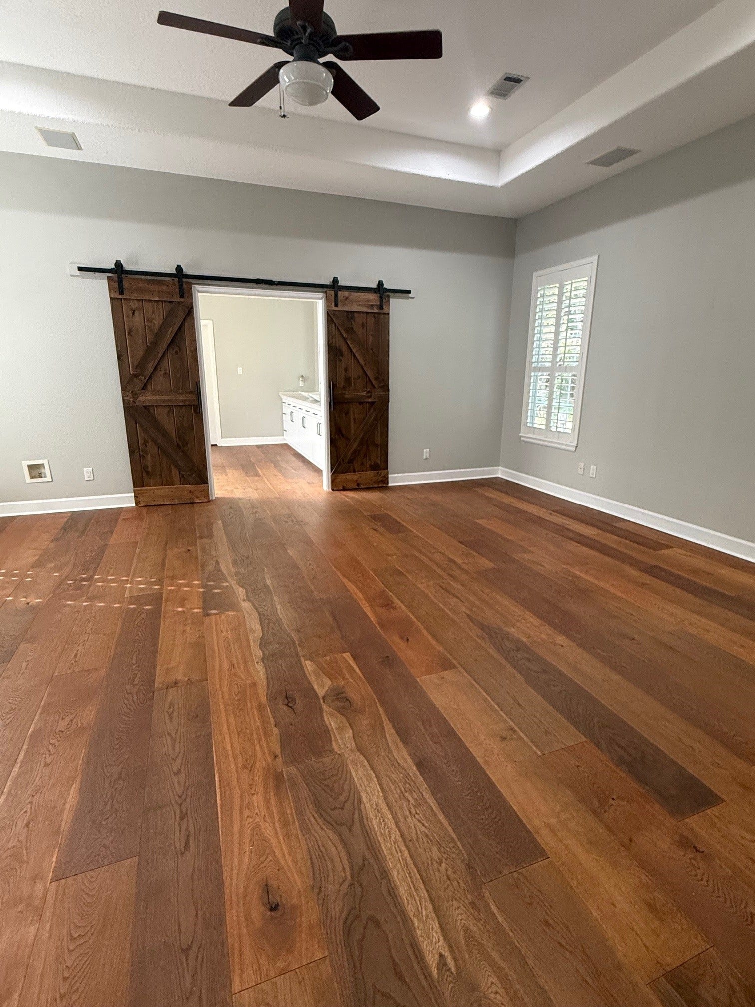 11011 Sea Mist, Magnolia, TX 77354 Spacious primary bedroom with barn doors to primary bath