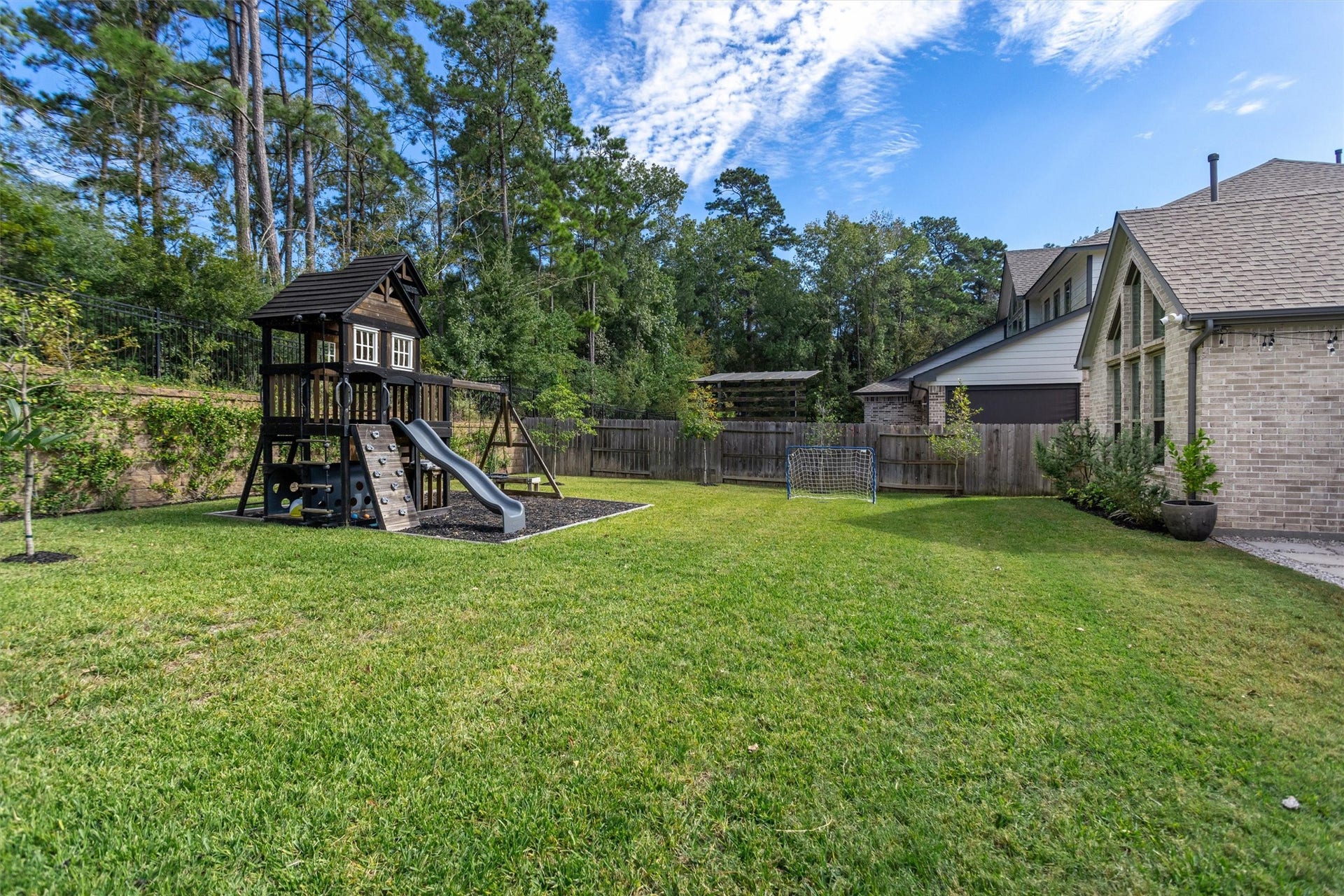 229 Patina Sorrel Drive, Montgomery, TX 77316 Beyond the extended patio, discover an expansive backyard offering endless possibilities! Perfect for kids to play, outdoor entertaining, or creating your dream poolside oasis, with plenty of room to make it your own.