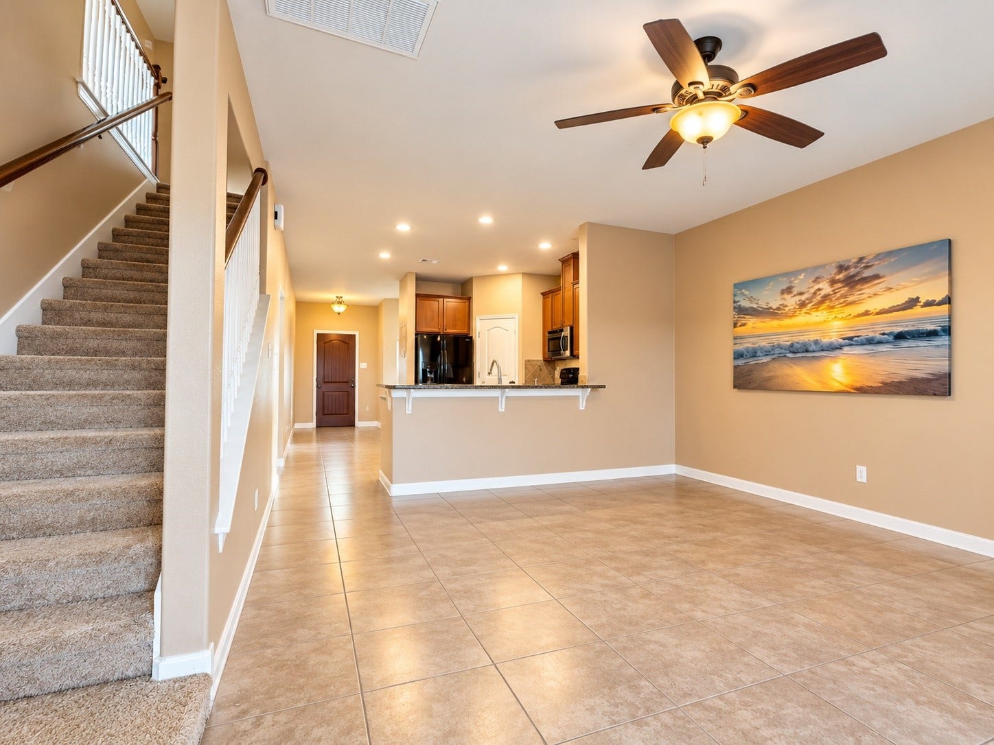 Thoughtfully designed floor plan featuring the primary bedroom downstairs, with four additional bedrooms and a spacious game room/living area upstairs.