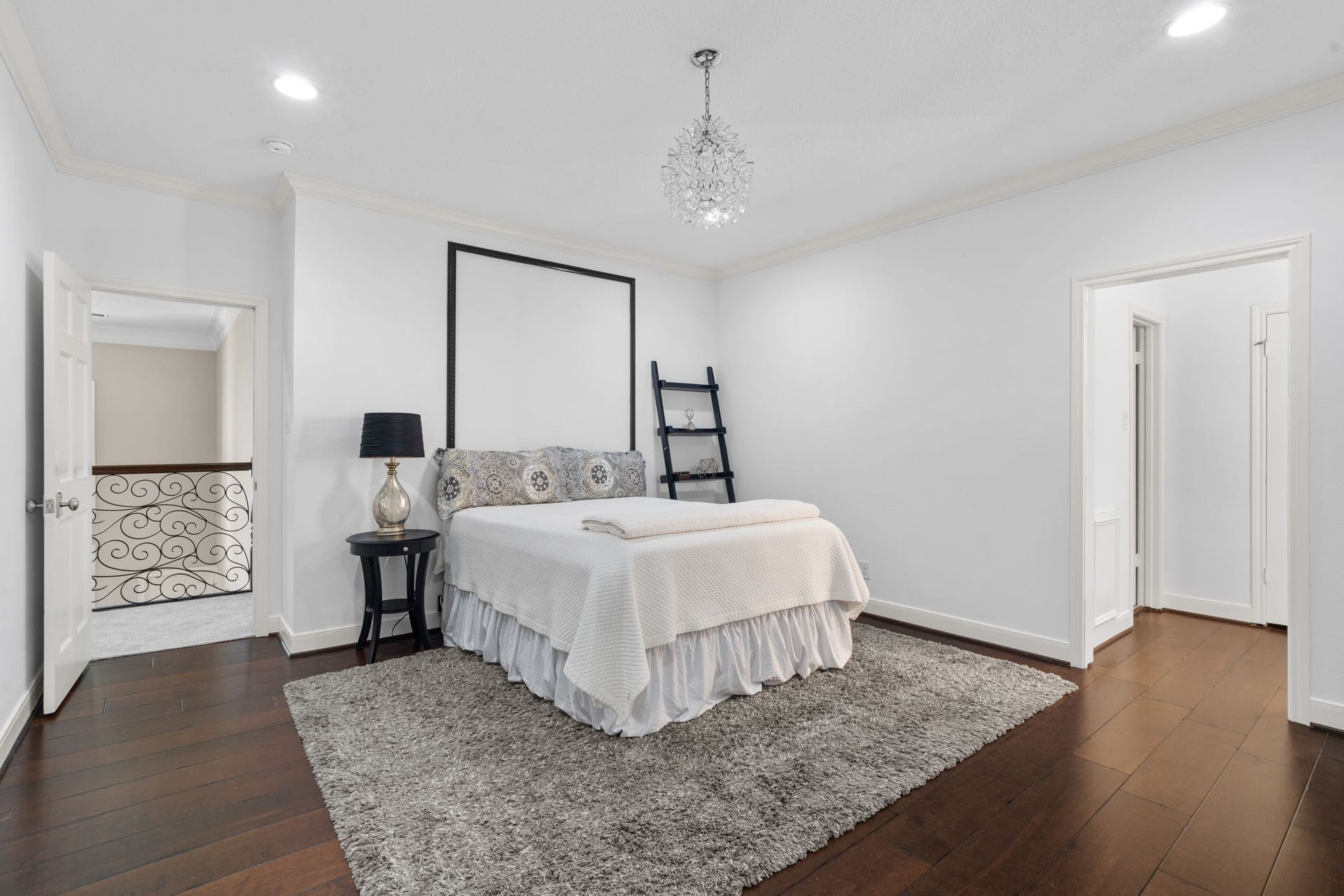 Secondary bedrooms feature hardwood flooring, walk-in closets, and private en suite bathrooms.