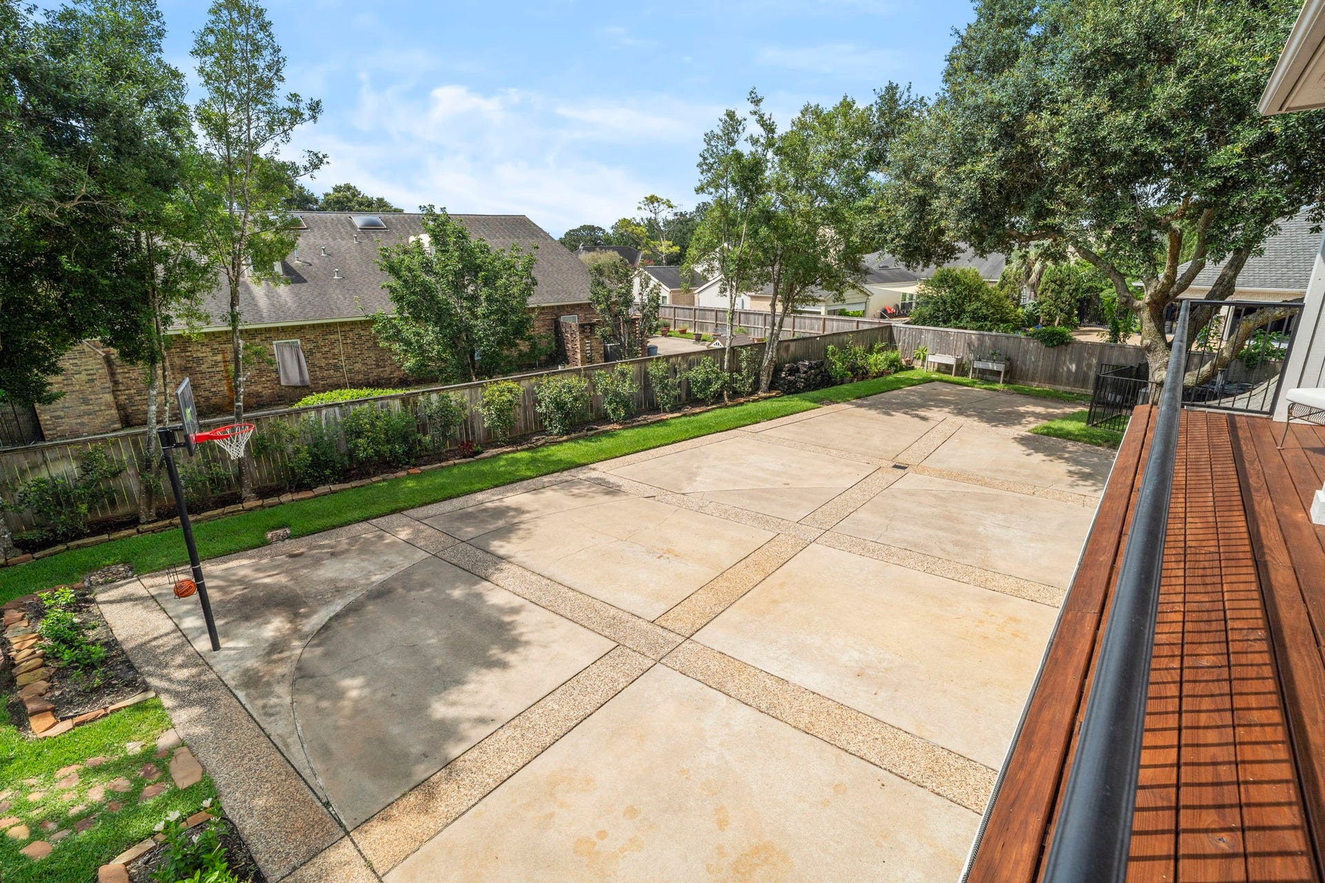 An expansive motor and sports court provides a private setting for recreation, outdoor activities, and entertaining.