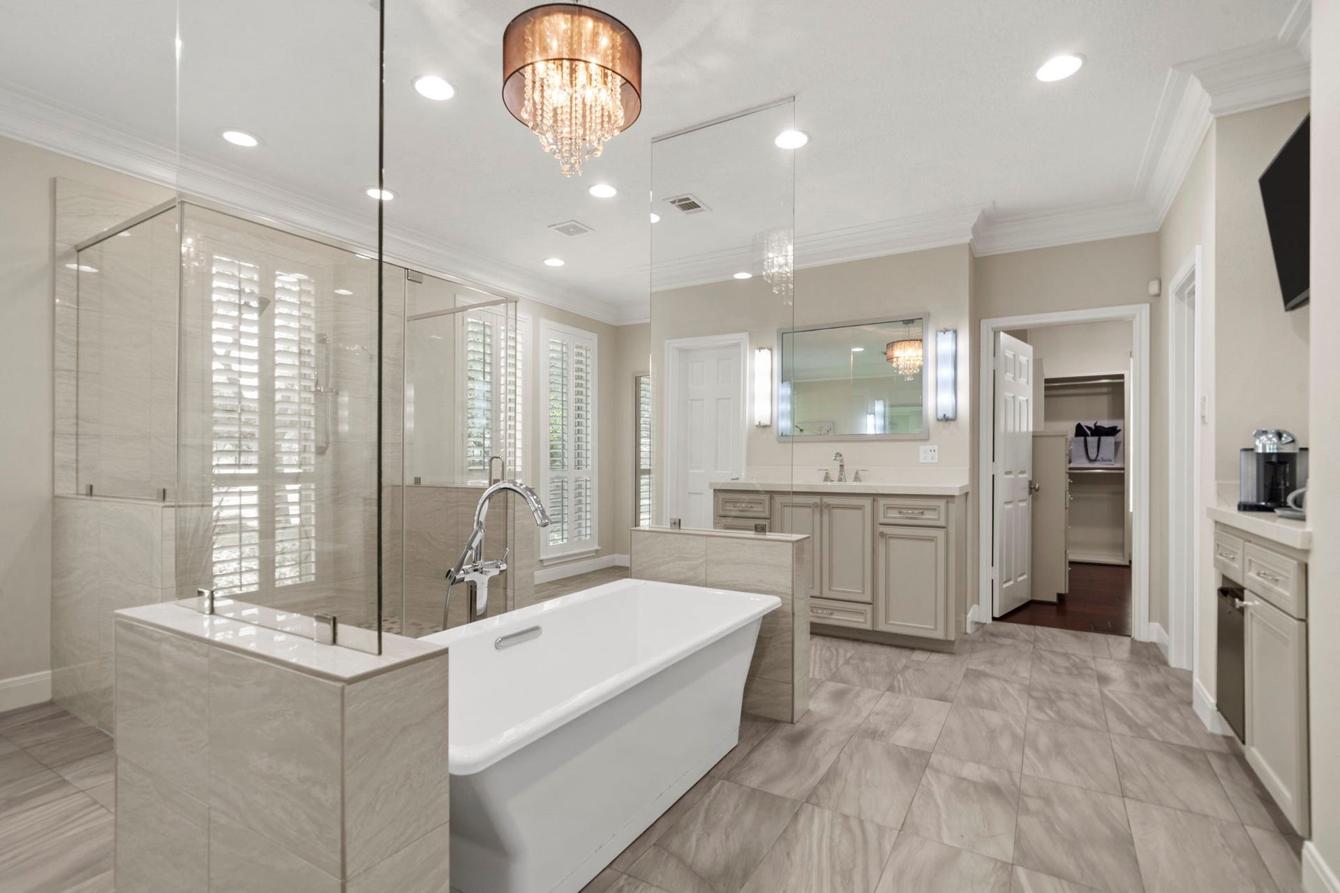 The owner's bath provides access to two exceptional walk-in closets, including a spacious 14x13 dressing room with ample space for wardrobe organization.
