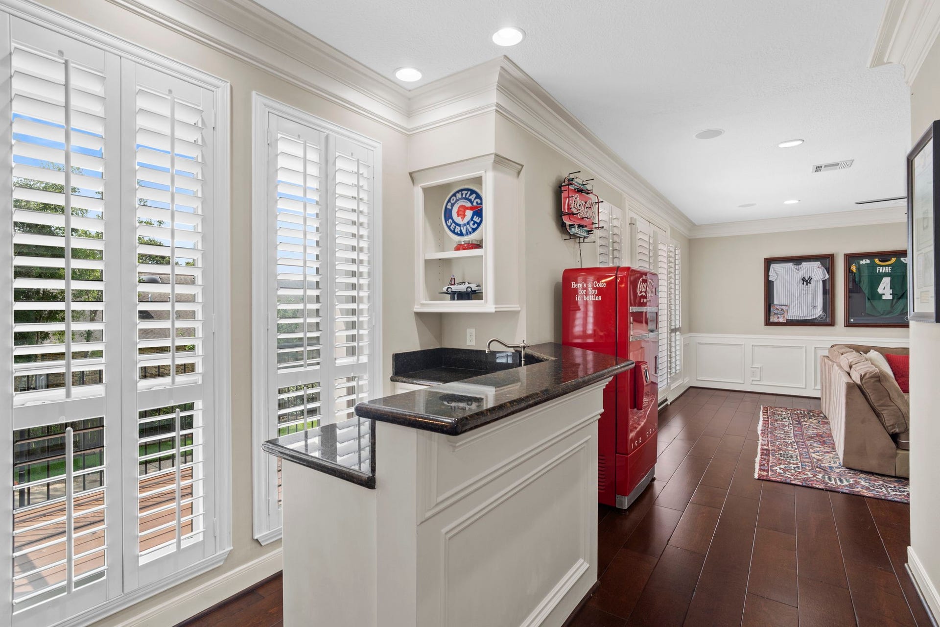 A second full bar elevates the upstairs game room, creating the perfect space for entertaining.
