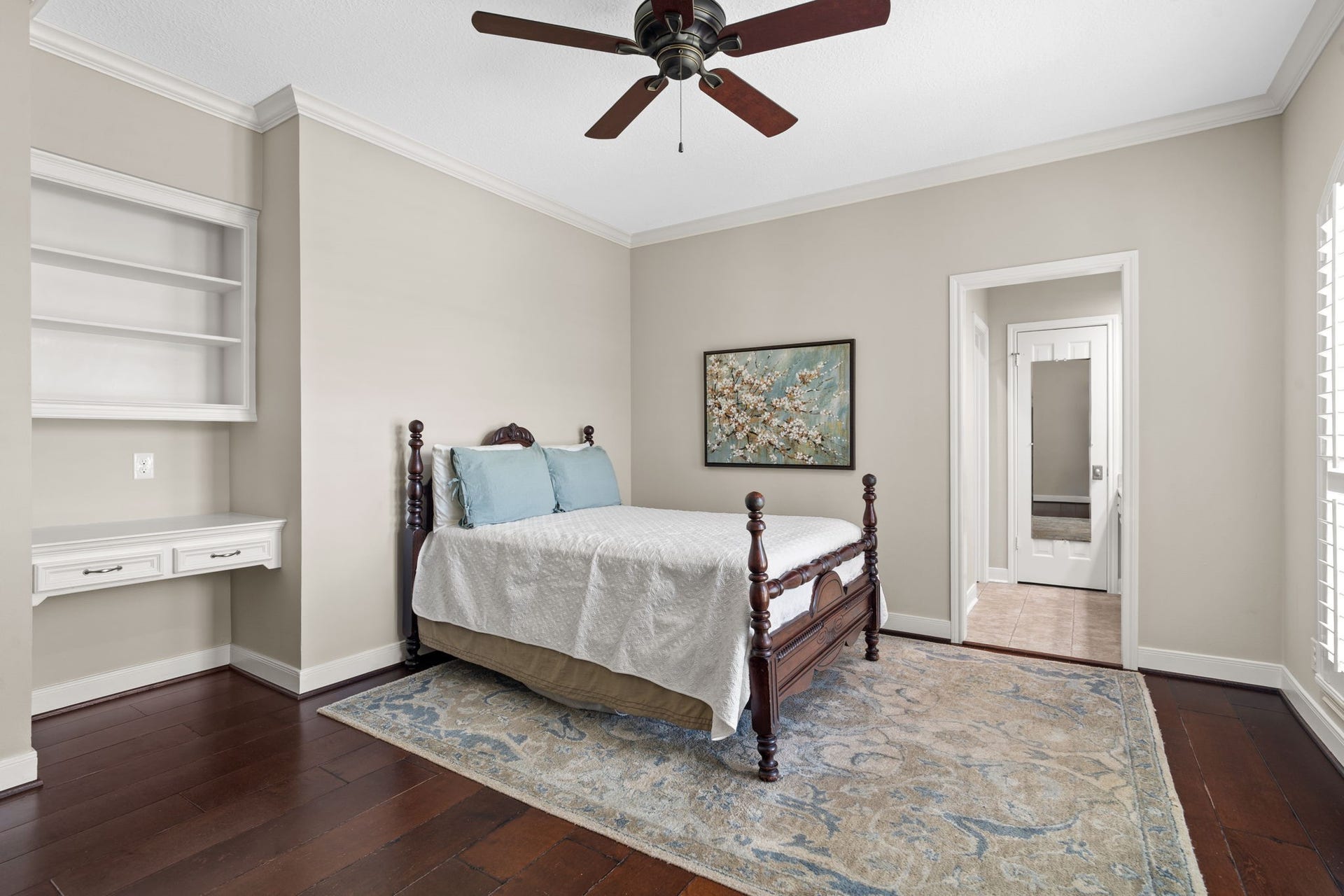 Built-in bookshelves and desk areas are functional and bring architectural interest to the secondary bedrooms.