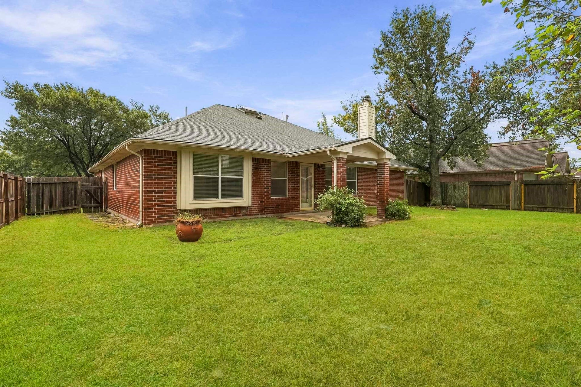14319 Floret Estates Court, Cypress, TX 77429 Enjoy a large backyard with a covered patio, perfect for relaxing or entertaining.